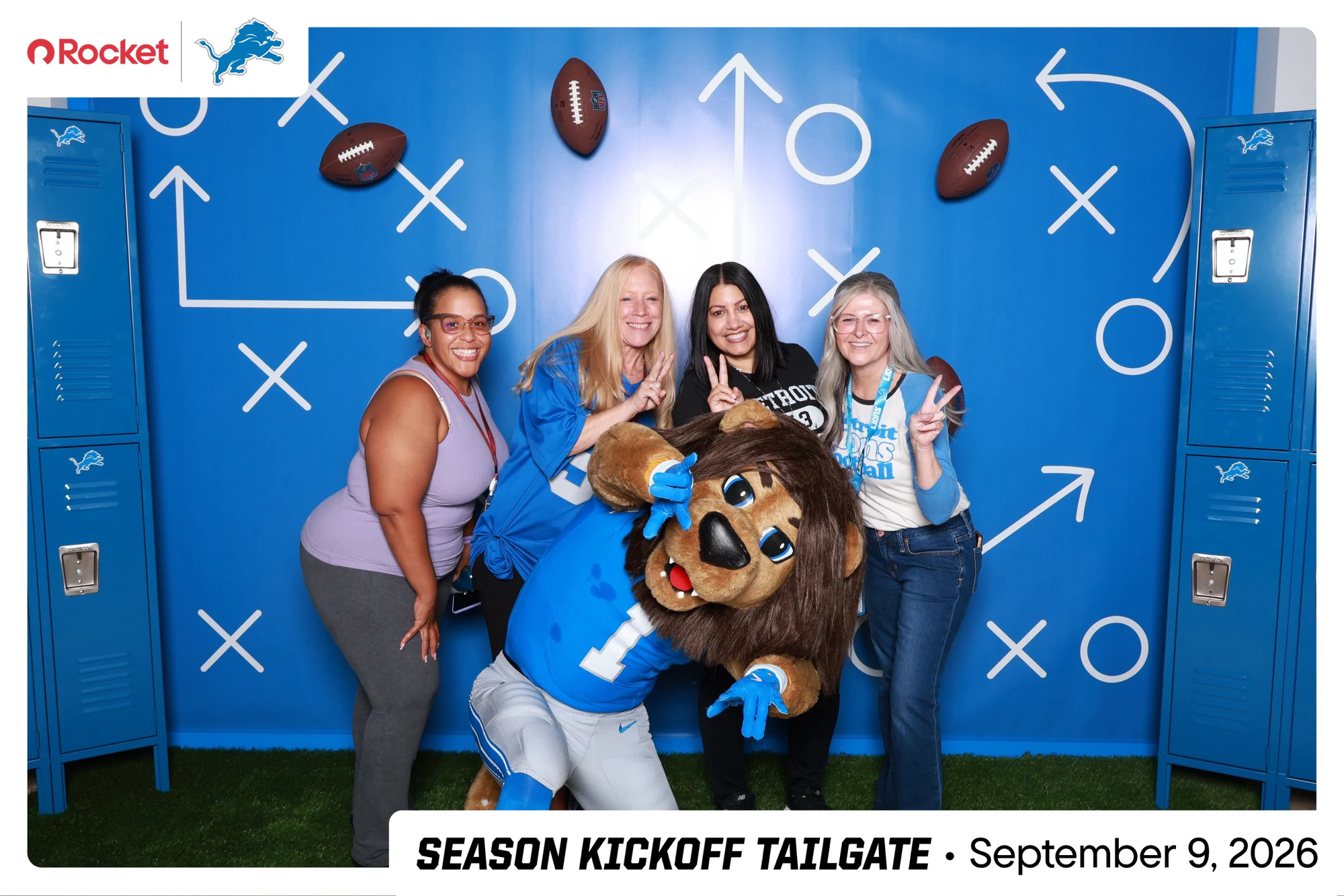 The mascot crouched in front of four guests at Lions Season Launch Week