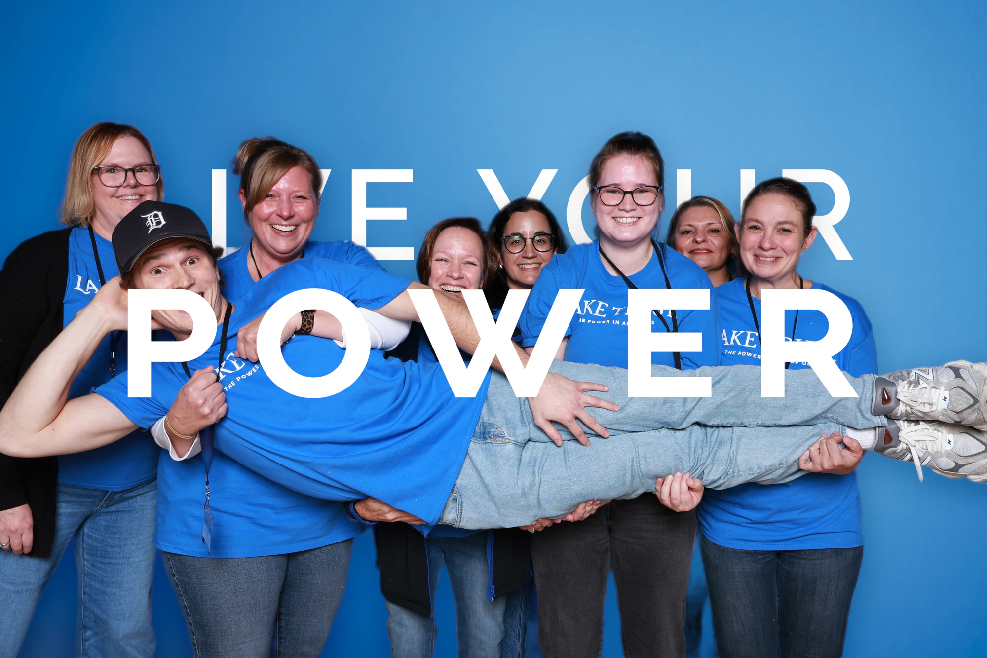 The group holding their friend steady for the last frame at Live Your Power