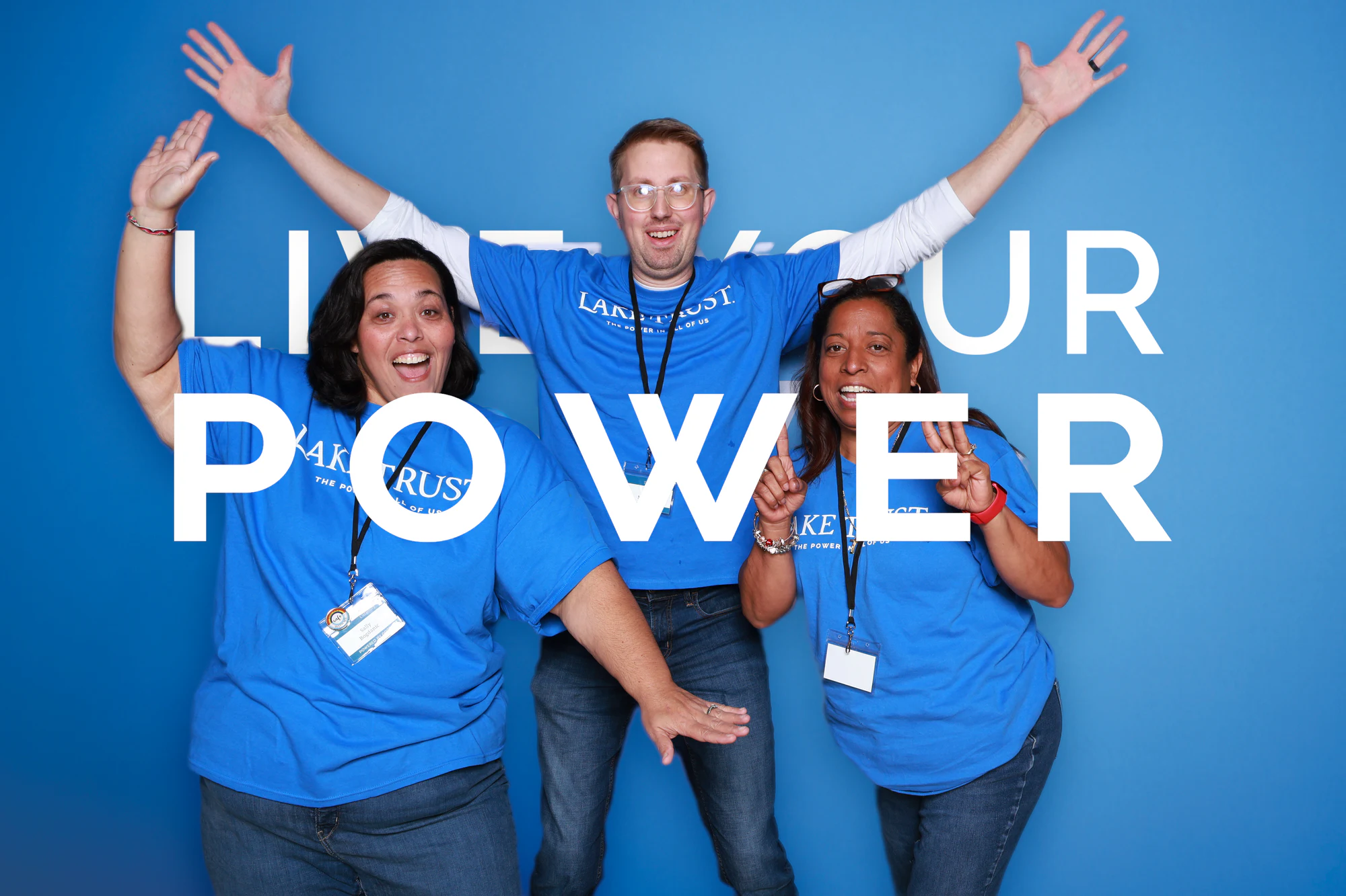 The three guests with their arms flung up and out at Live Your Power