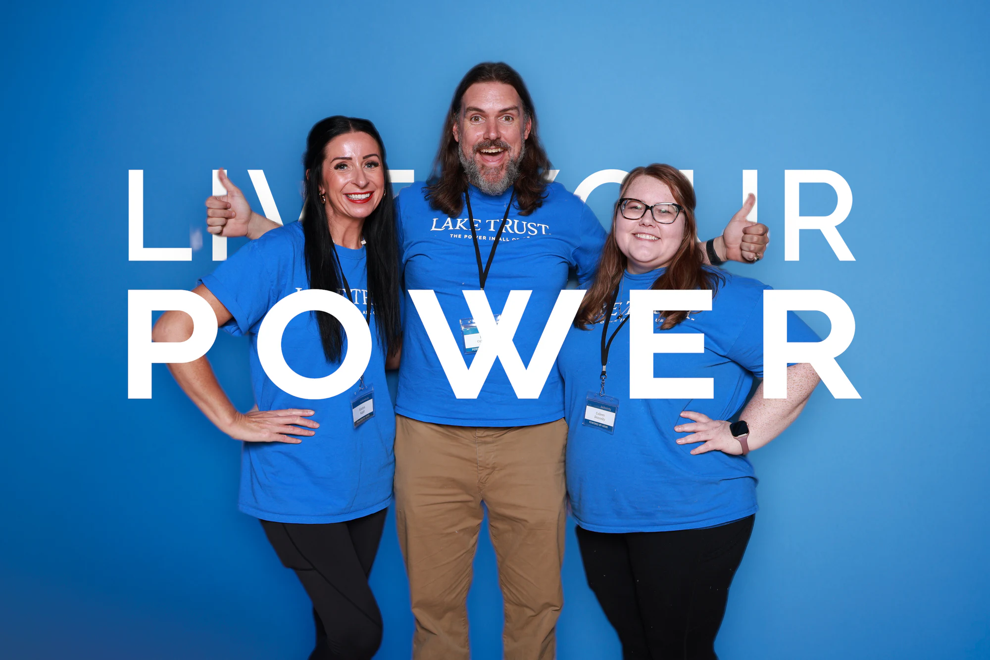 Three guests, two of them giving a thumbs up at Live Your Power