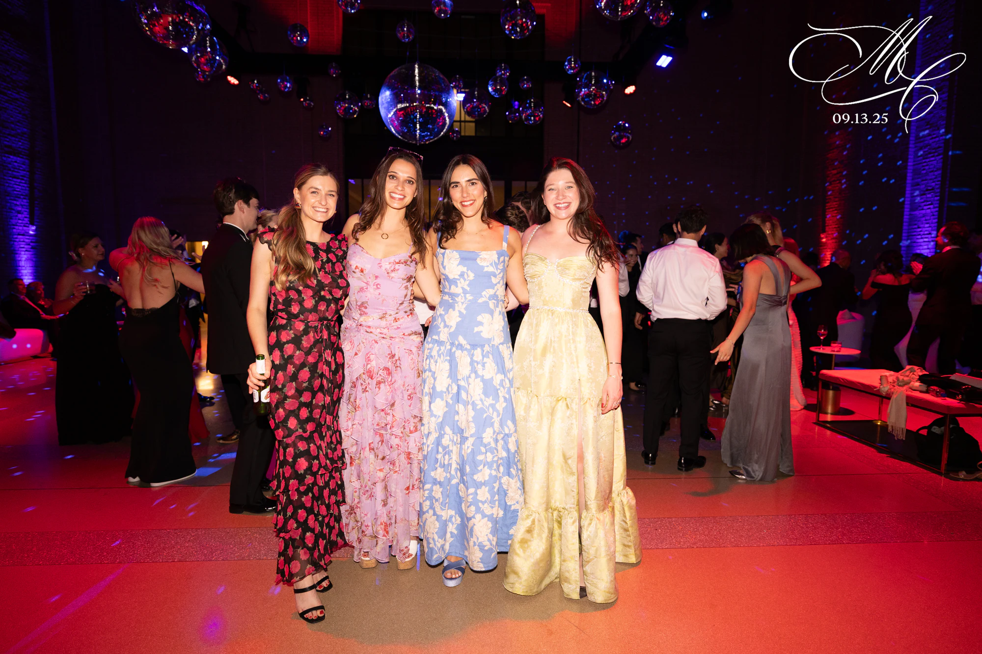 Four on the dance floor under the purple wash at Madison + Charlie at Michigan Central