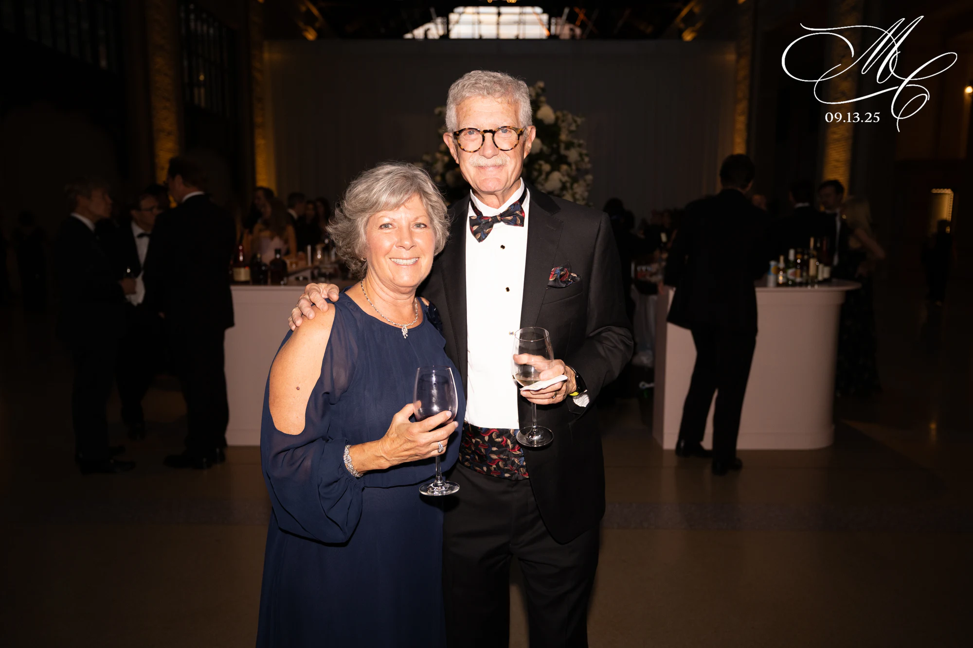 Older couple with wine at Madison + Charlie at Michigan Central