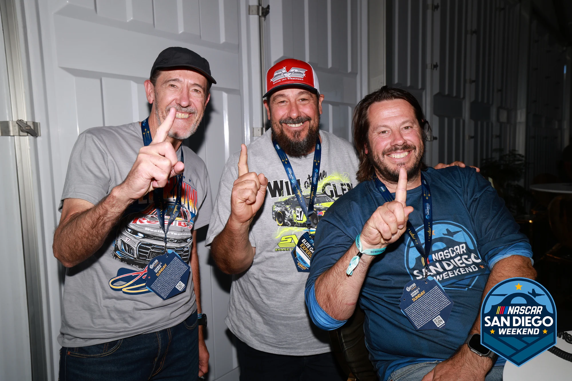 Three guests with their hands up at NASCAR San Diego