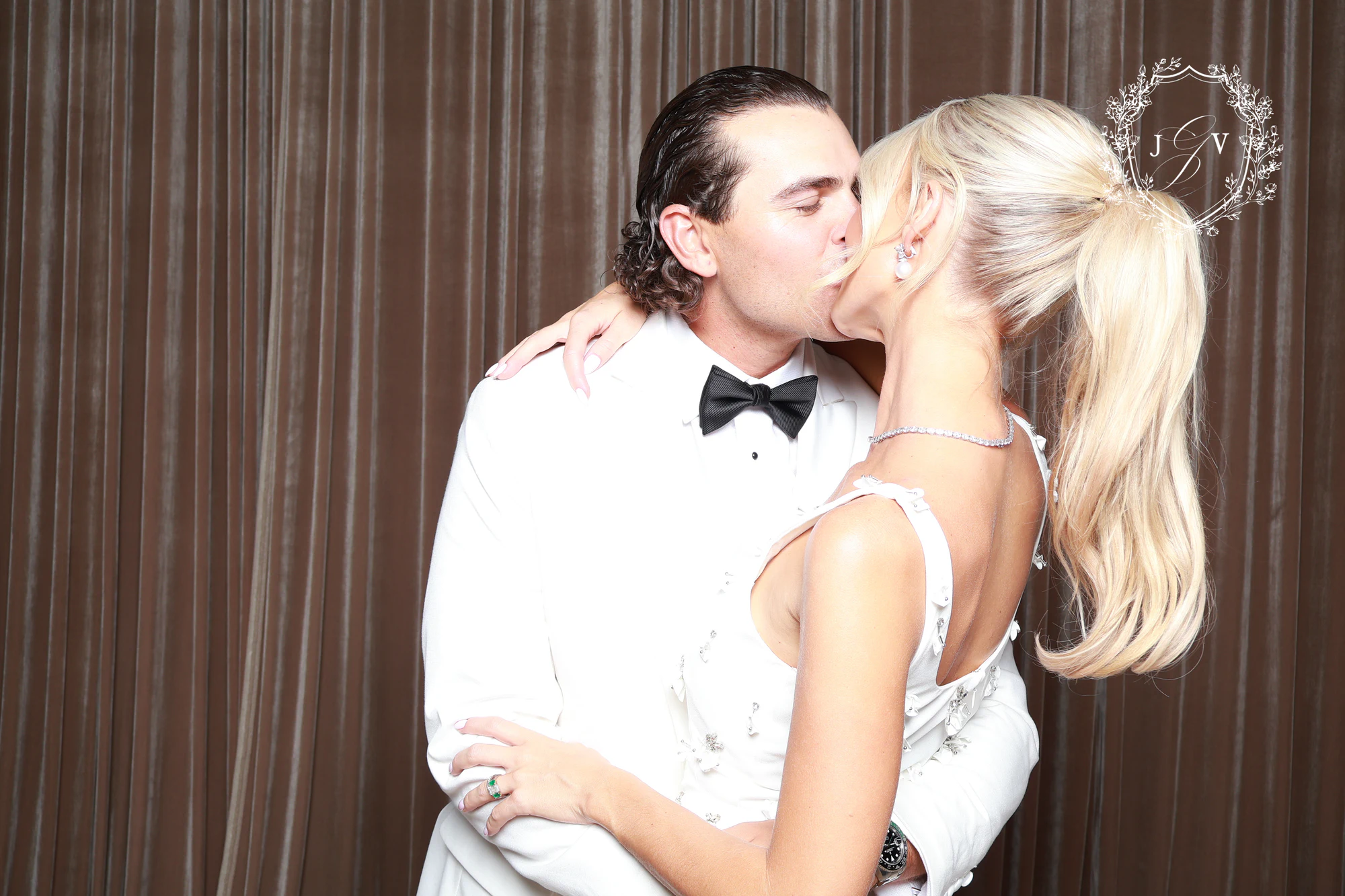 The groom kissing the bride at Nash Gaurino Wedding