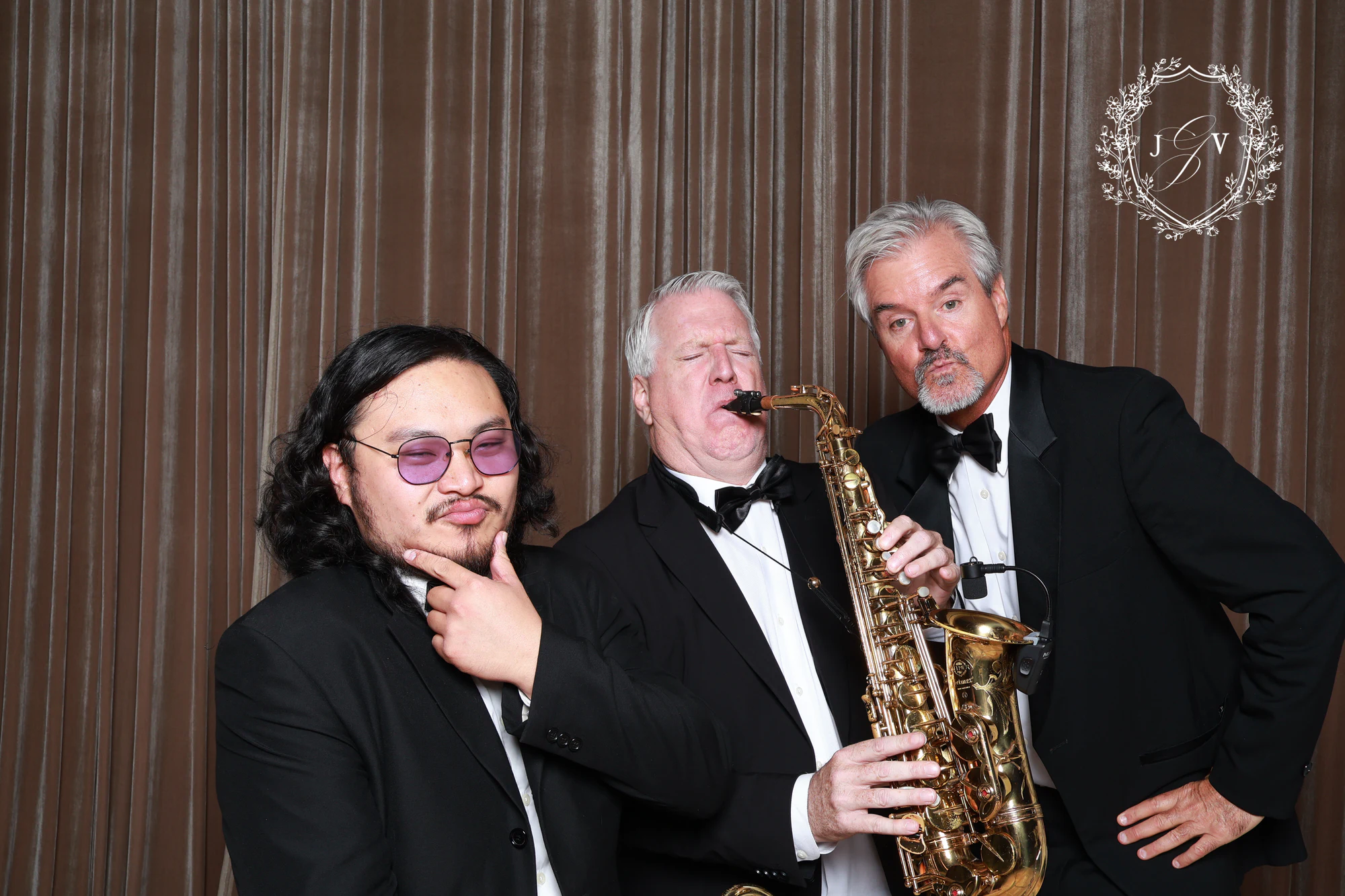 The three musicians clowning, the saxophone up front at Nash Gaurino Wedding