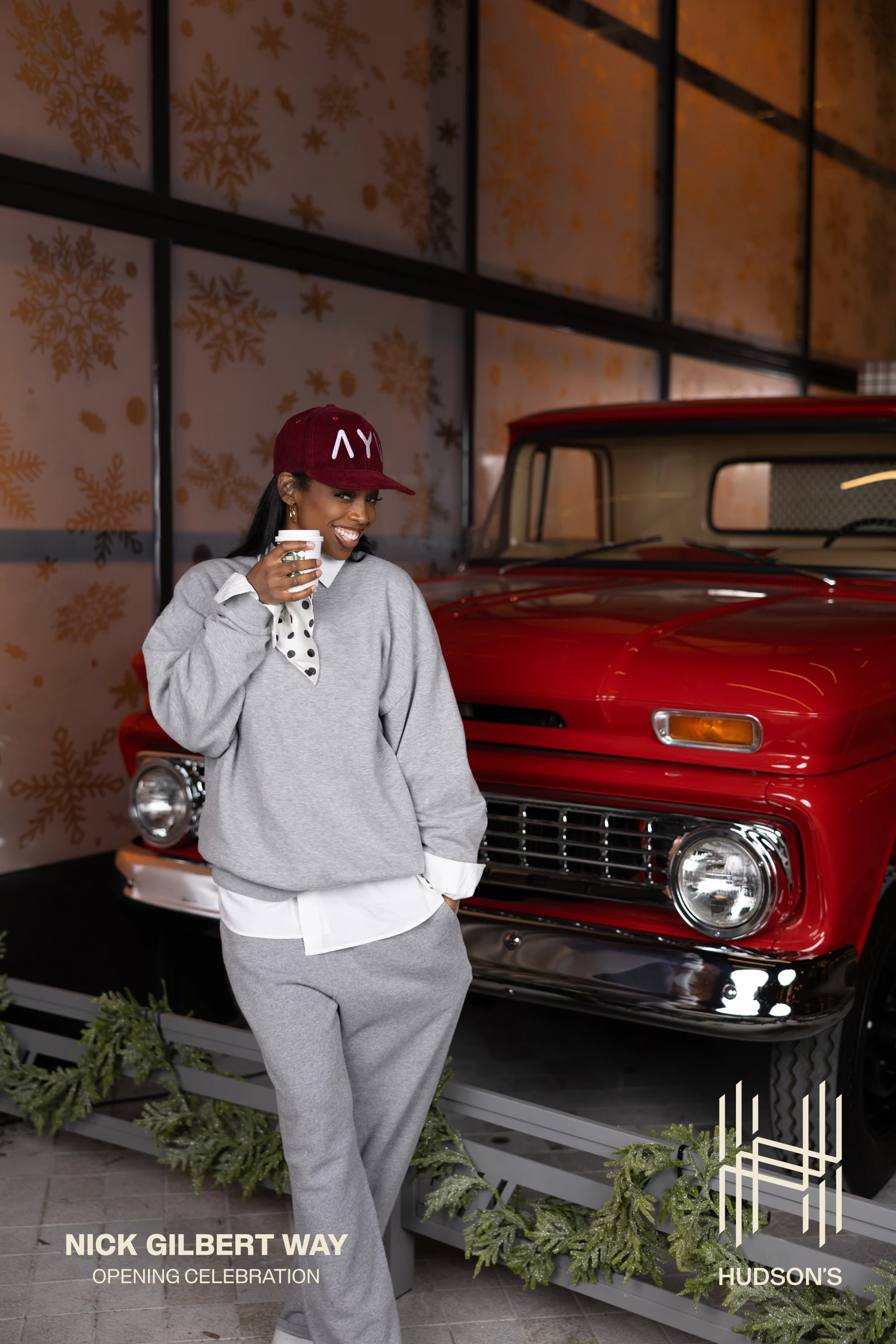 Guy in the red cap and gray sweats with a cup at Nick Gilbert Way Opening Celebration