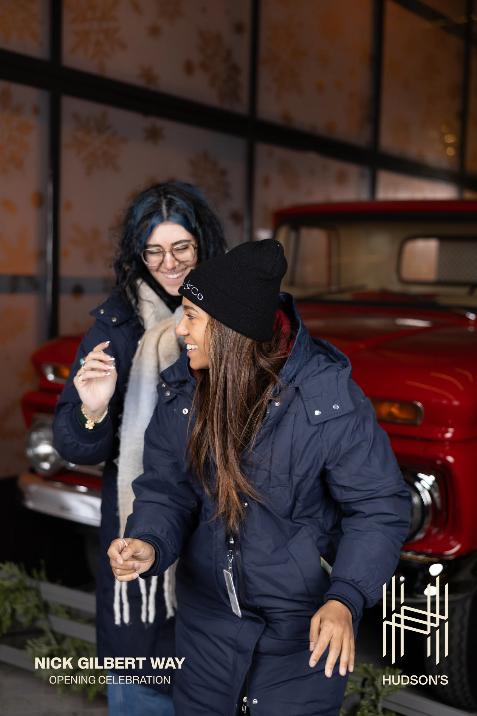 The same pair turned to each other, laughing at Nick Gilbert Way Opening Celebration