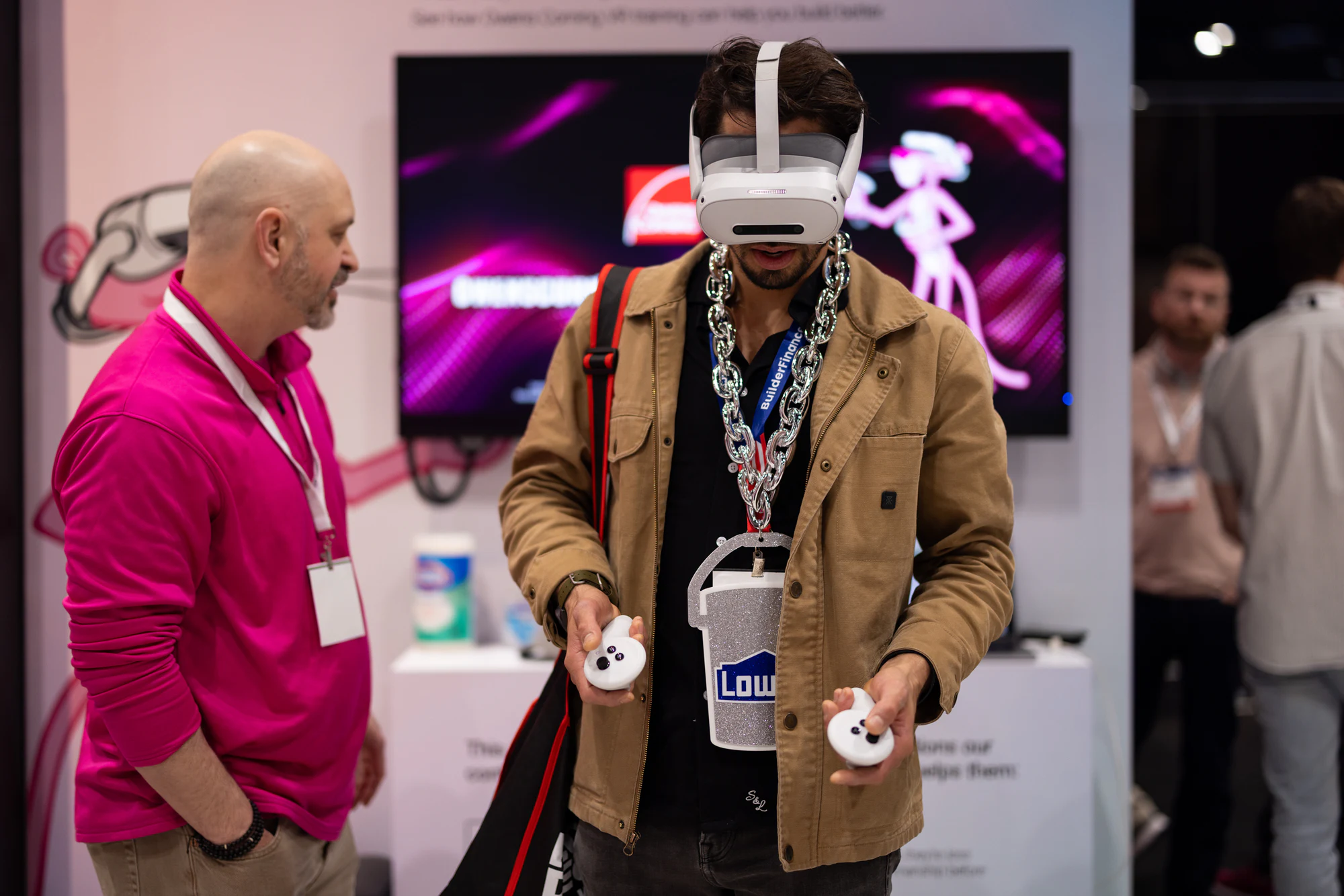 Contractor in a VR headset against the pink Panther screen at Owens Corning at IBS 2026
