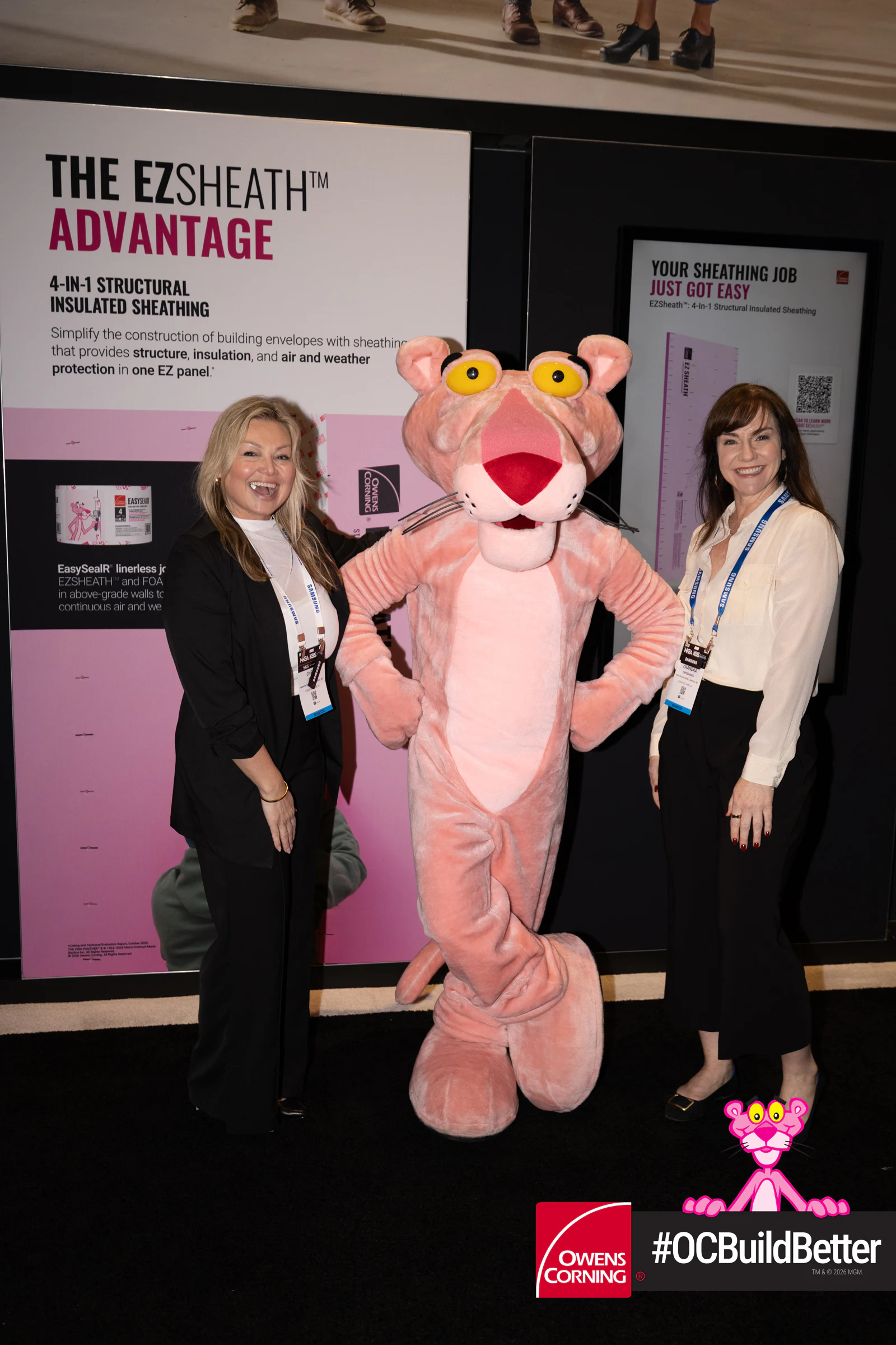 Three women with the Panther, all smiling at Owens Corning at IBS 2026