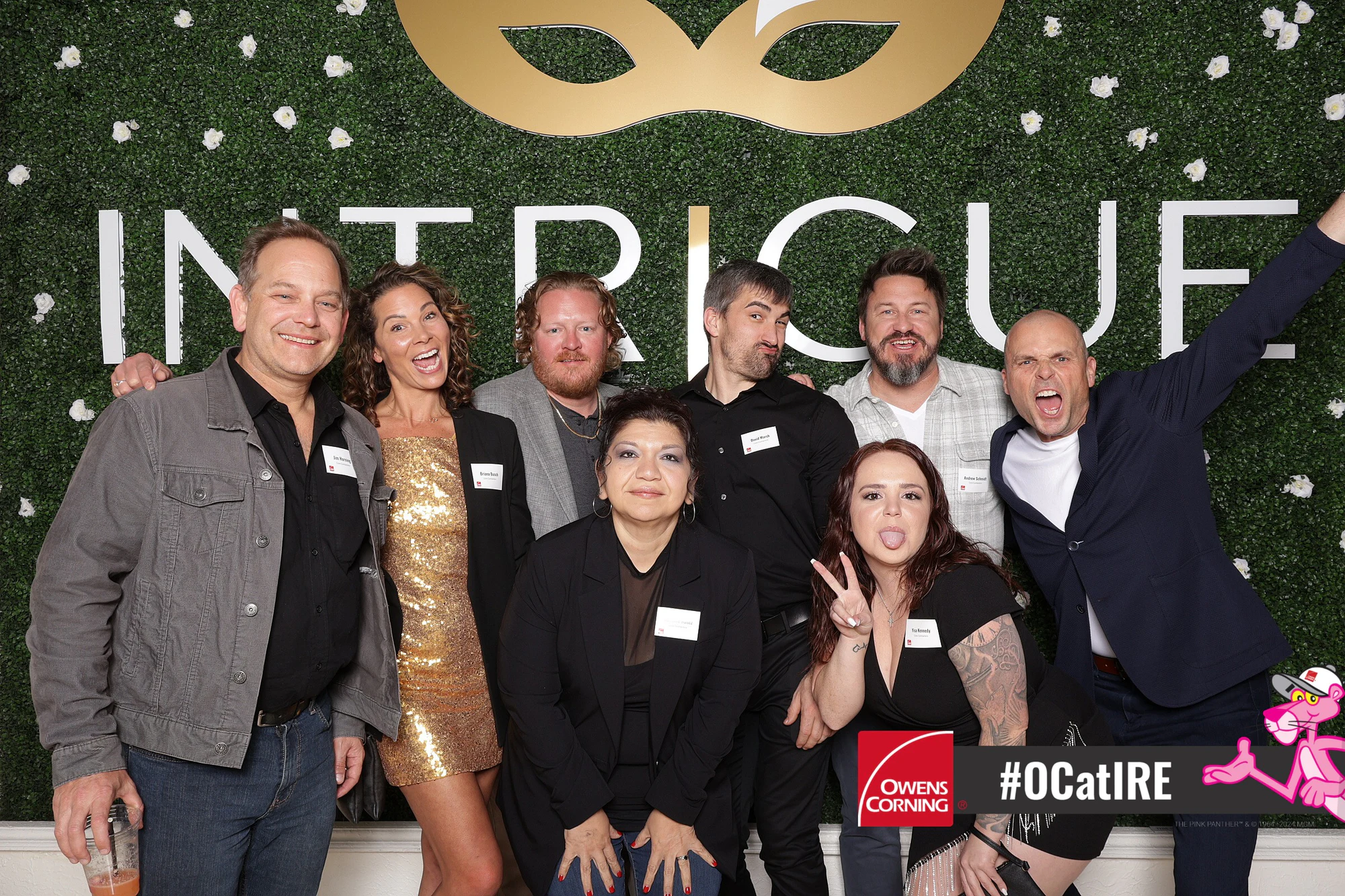Group mid-cheer with a woman in gold at the center at Owens Corning at IRE 2024