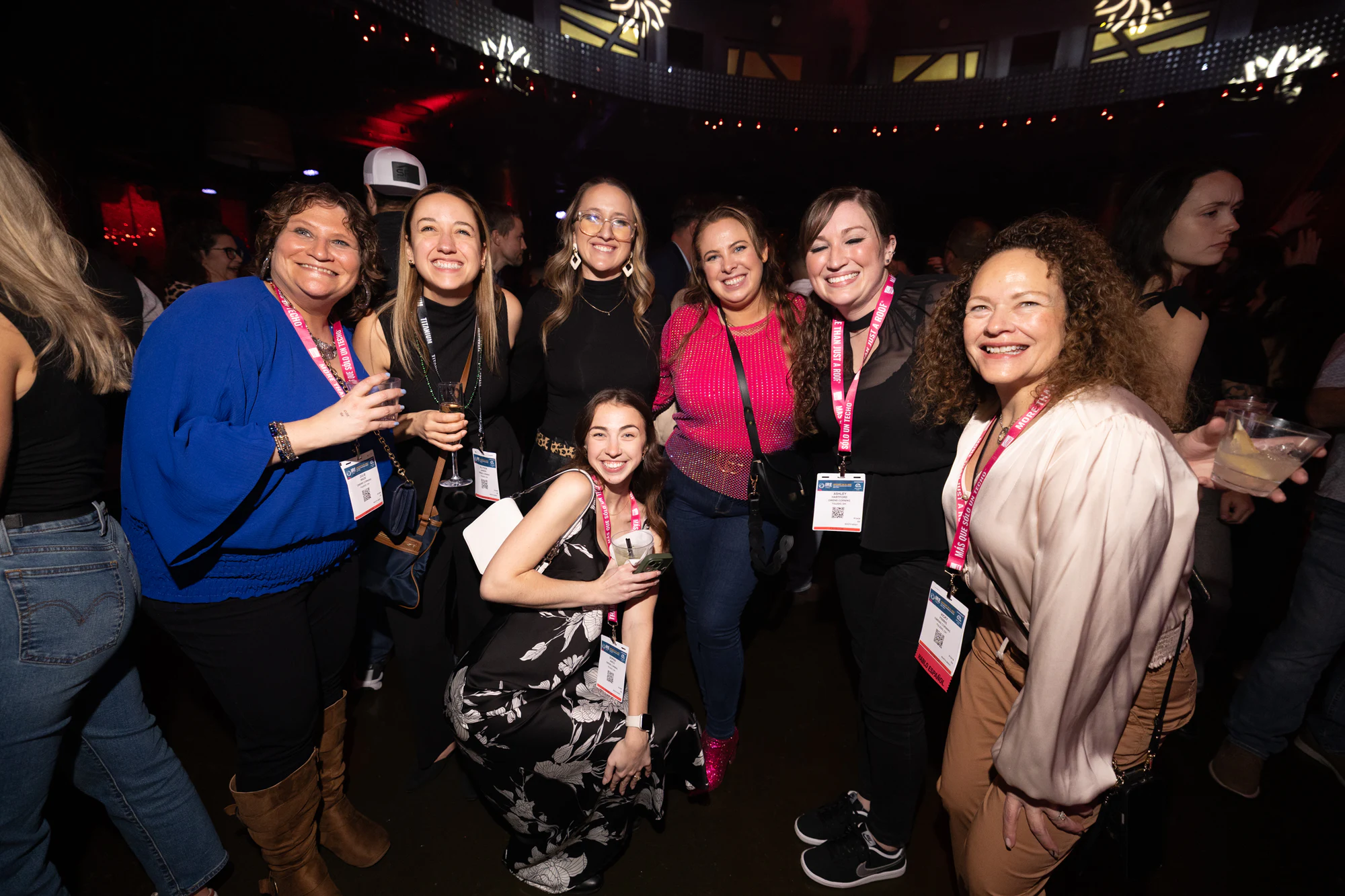 Group of women cheering together at XS at Owens Corning at IRE 2026