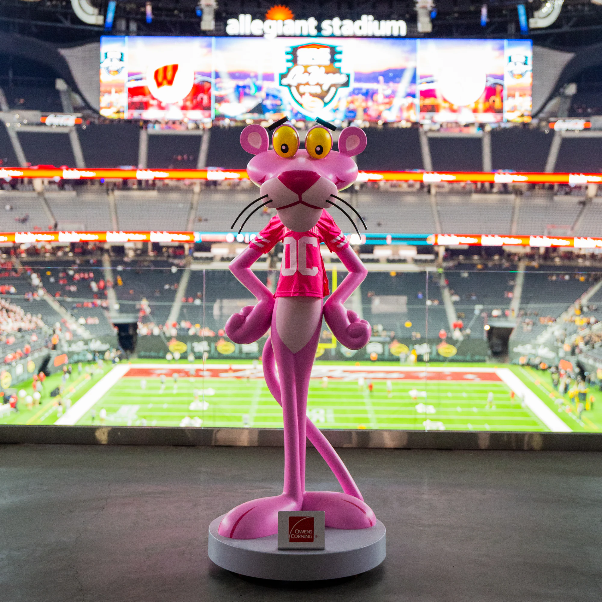 Pink Panther statue in an Owens Corning jersey overlooking the field, Las Vegas Bowl logo on the scoreboard at Owens Corning at the 2021 Las Vegas Bowl
