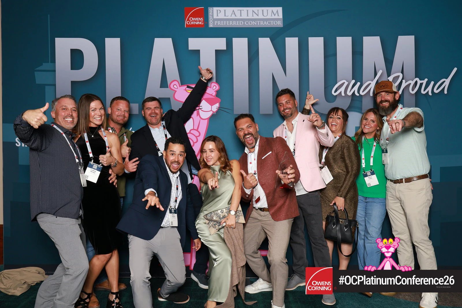 The same eleven letting go, arms up, leaning in and pointing at the camera at Owens Corning Platinum Conference 2026