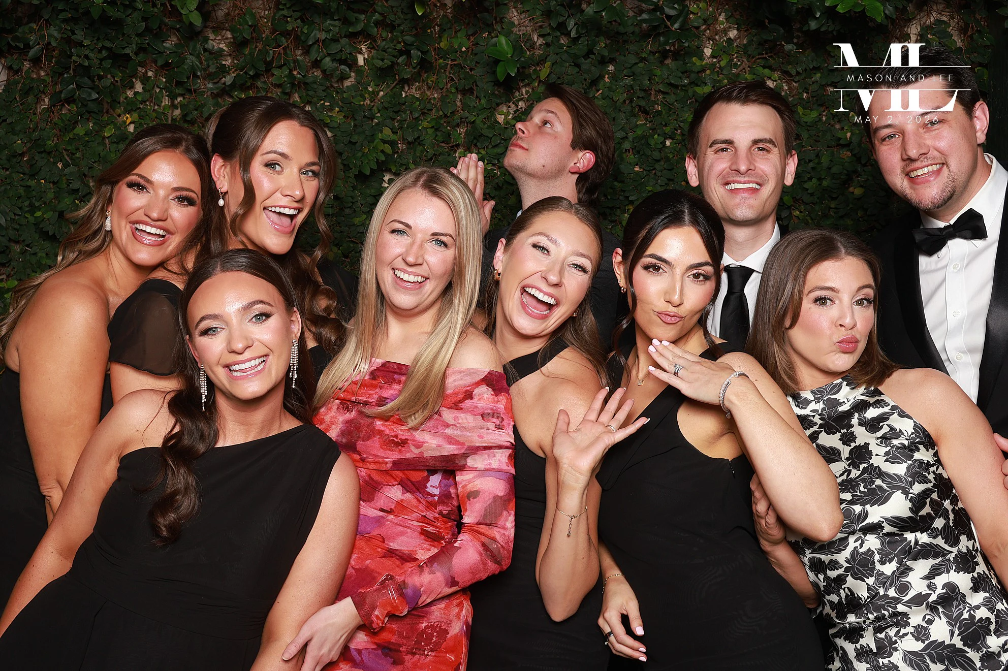 Seven crammed in with hands up, everyone laughing at Mason + Lee at Planterra Conservatory