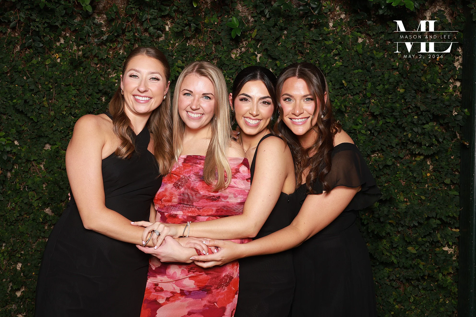 Four women in a hug circle at Mason + Lee at Planterra Conservatory