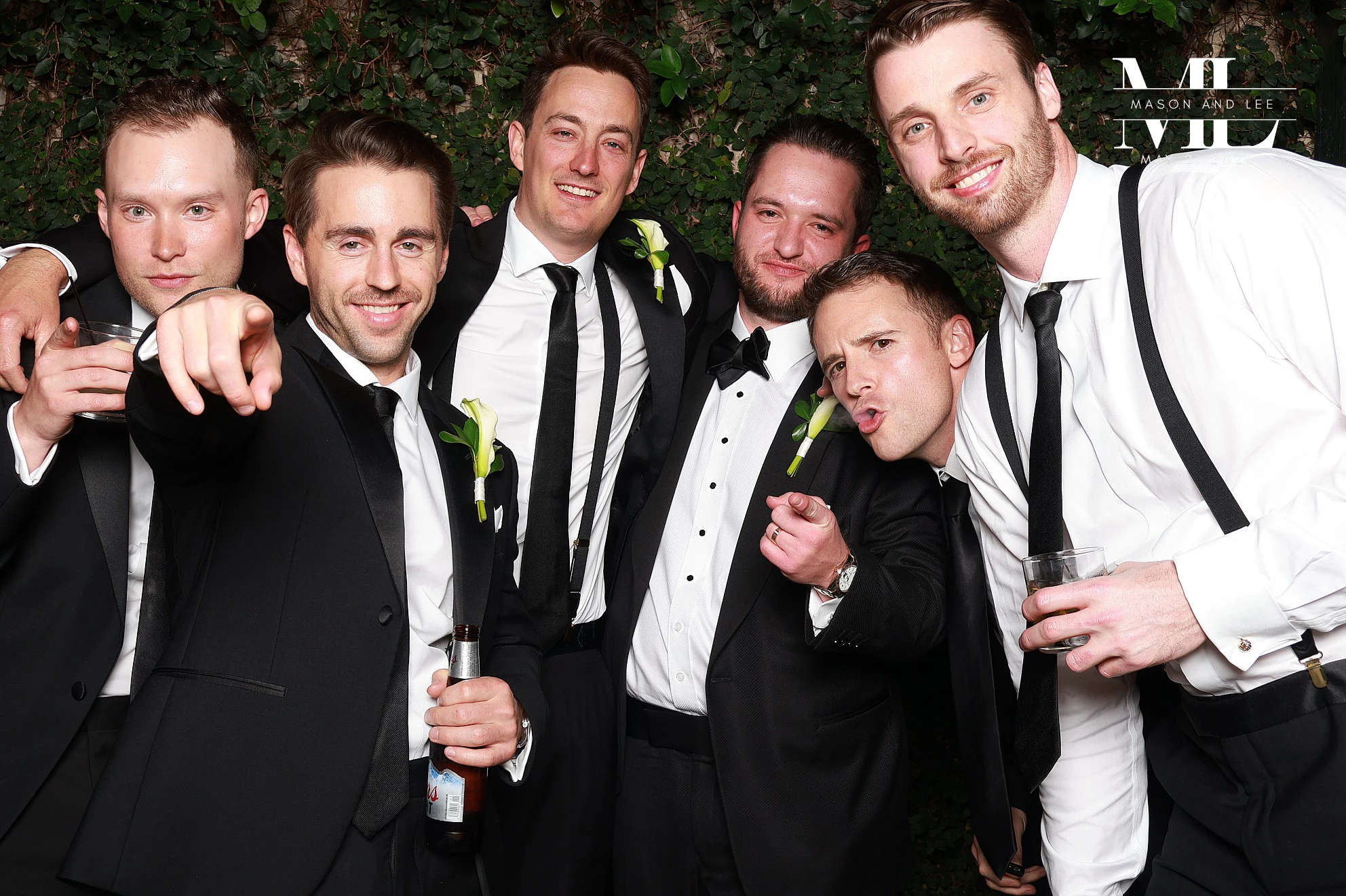 Five men pointing at the lens at Mason + Lee at Planterra Conservatory
