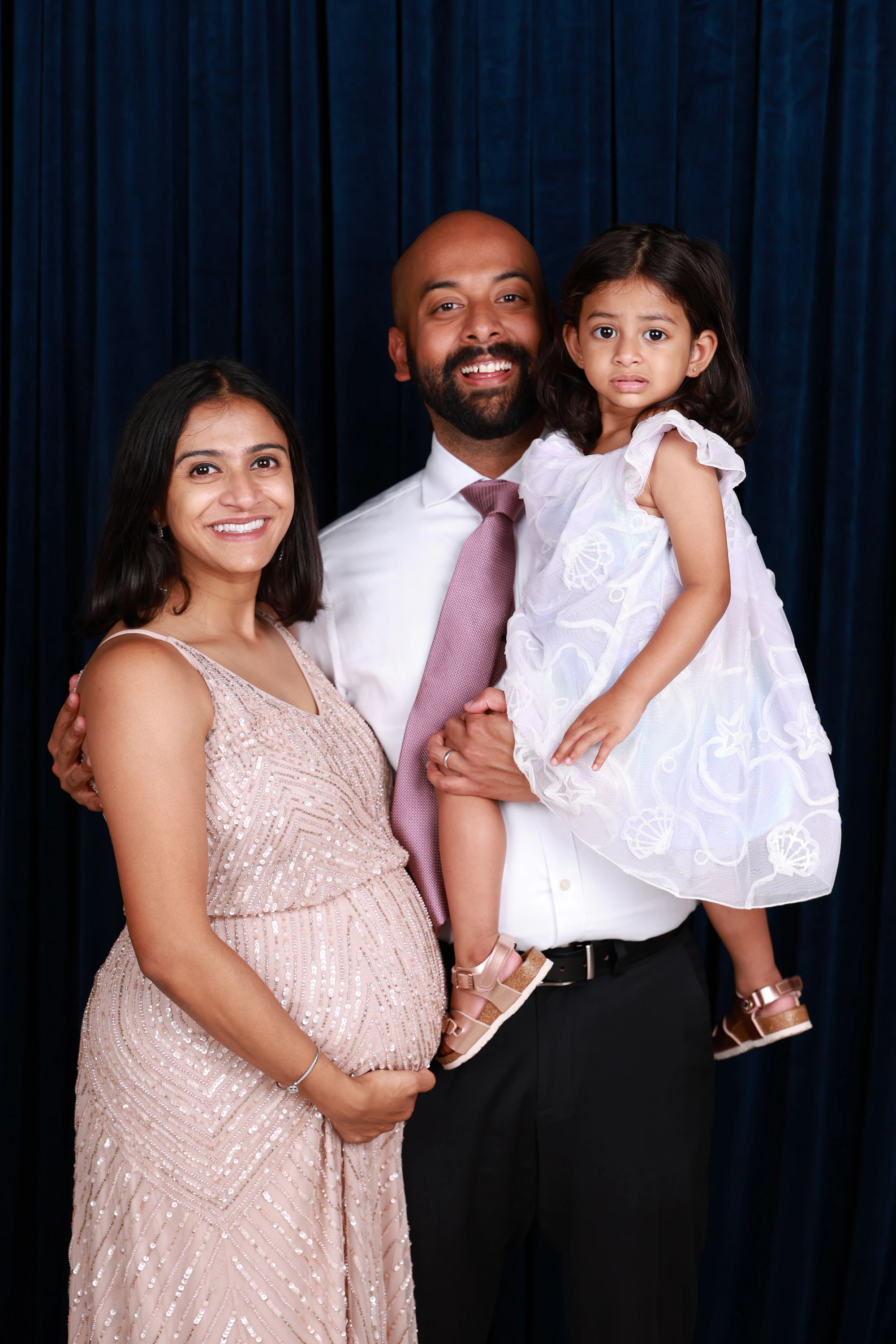 Couple with their toddler at Ramya + Sreehari