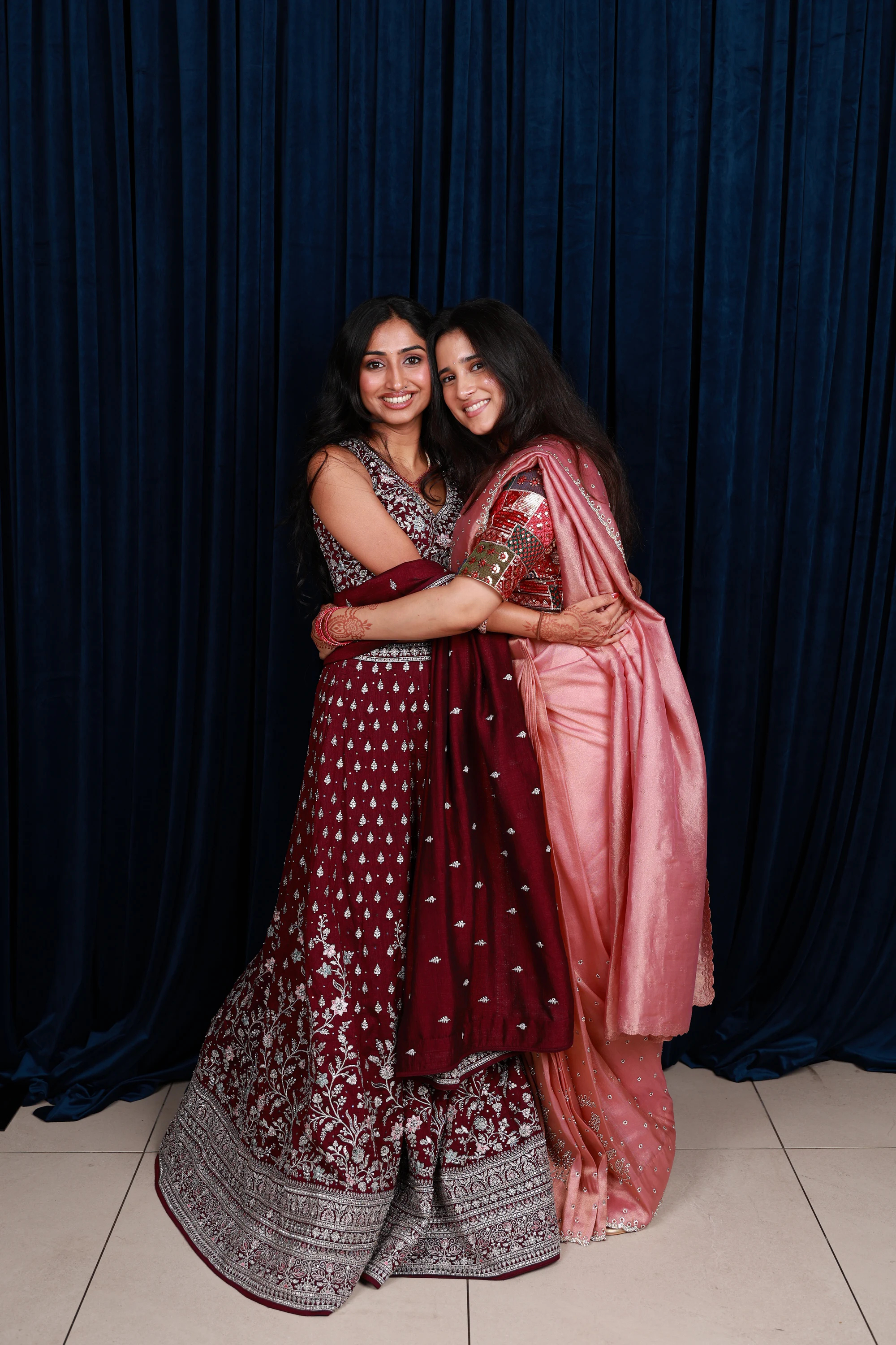 The same pair full length, heads together at Ramya + Sreehari