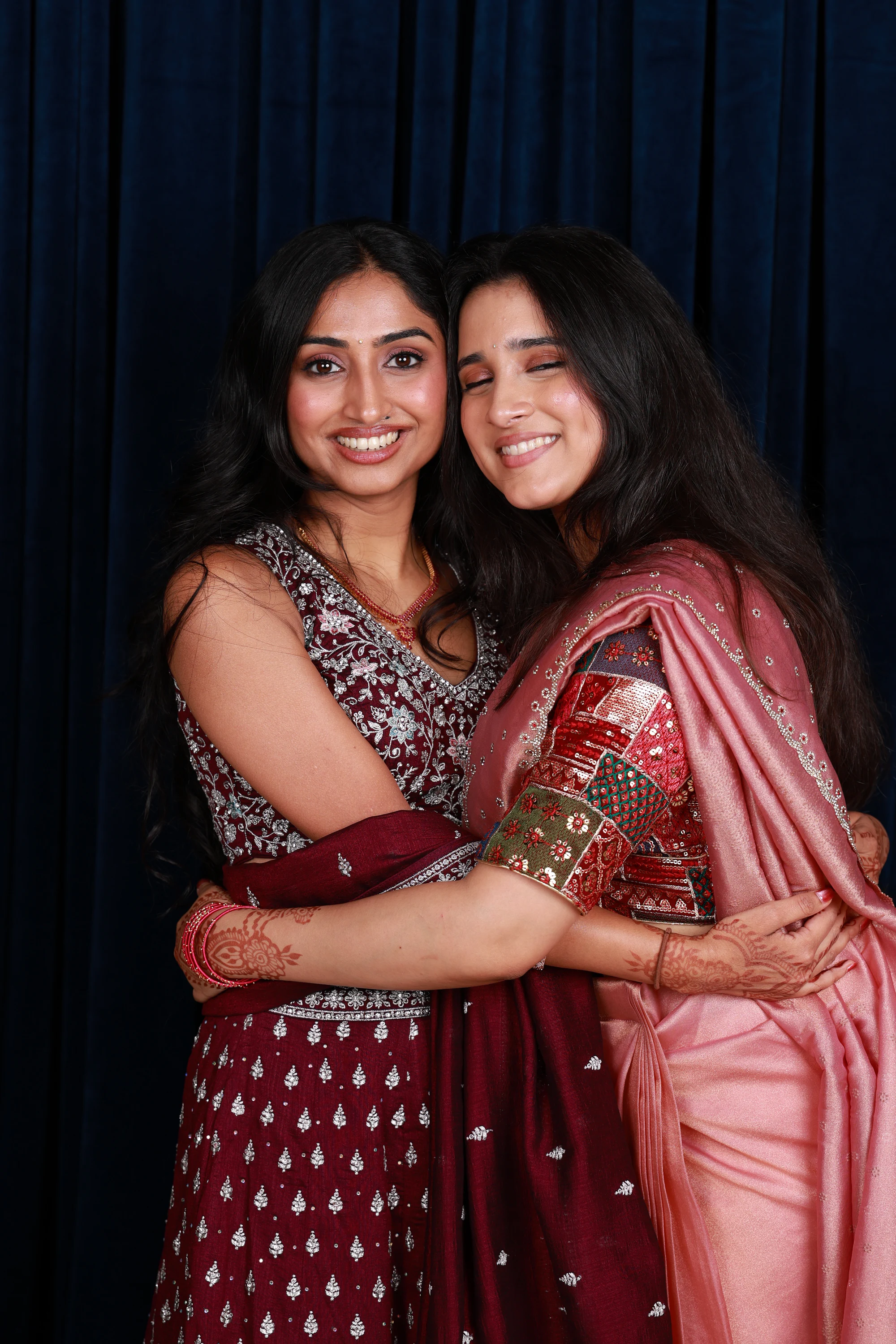 The same pair close, one leaning in with her eyes closed at Ramya + Sreehari