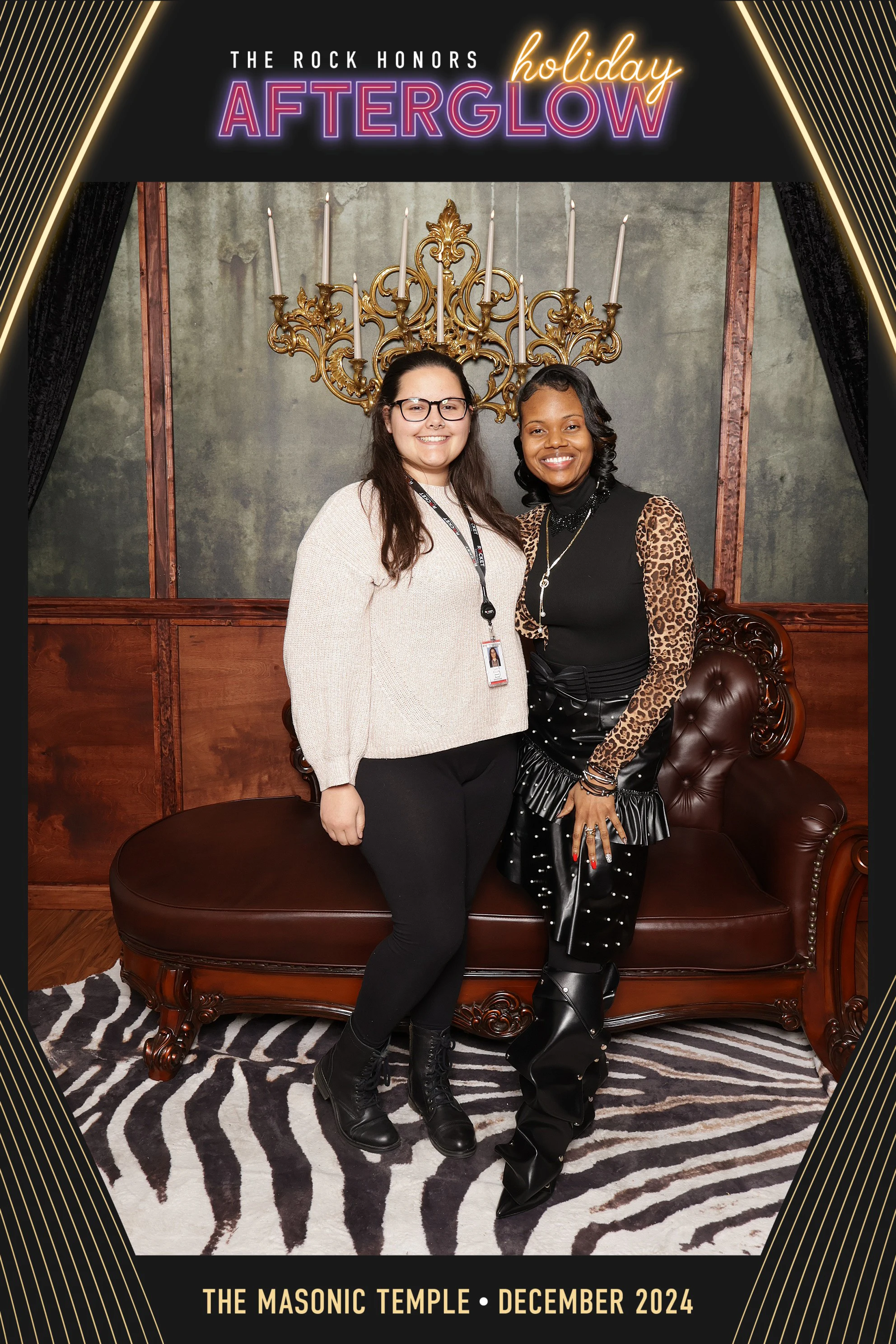 Two women on the zebra rug in the Speakeasy set at Rock Honors AfterGlow