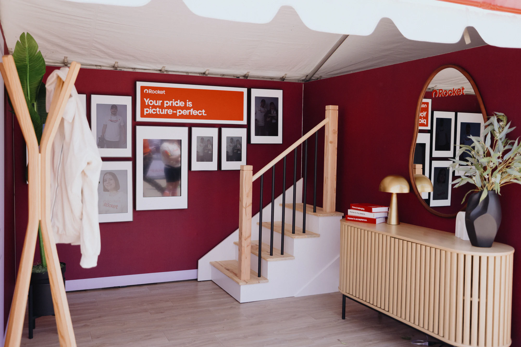 The foyer set: staircase, gallery wall, console at My Chosen Family Portraits at Motor City Pride 2025