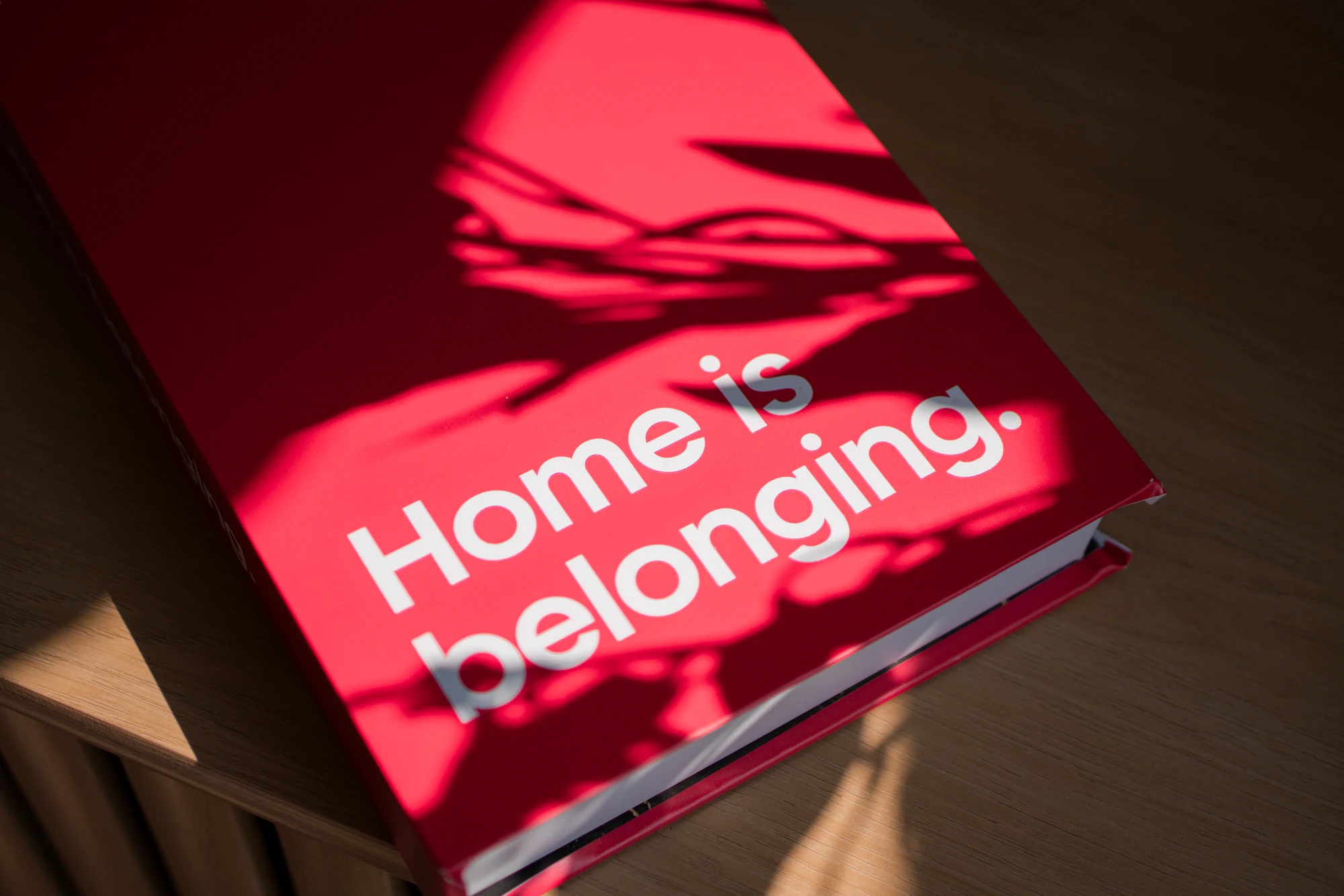 “Home is belonging” booklet at My Chosen Family Portraits at Motor City Pride 2025