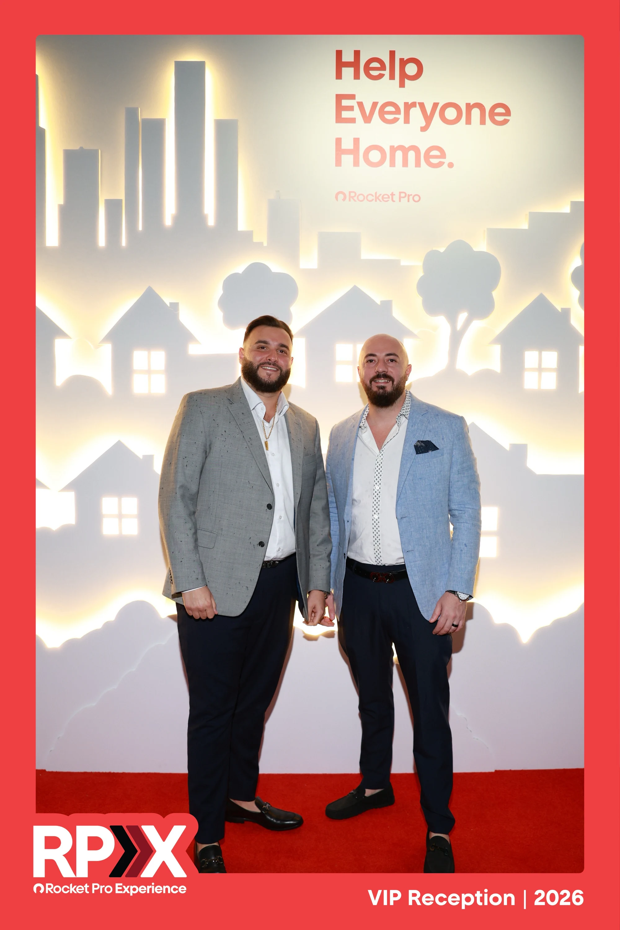 Two guests at the Help Everyone Home wall at Rocket Pro Experience 2026