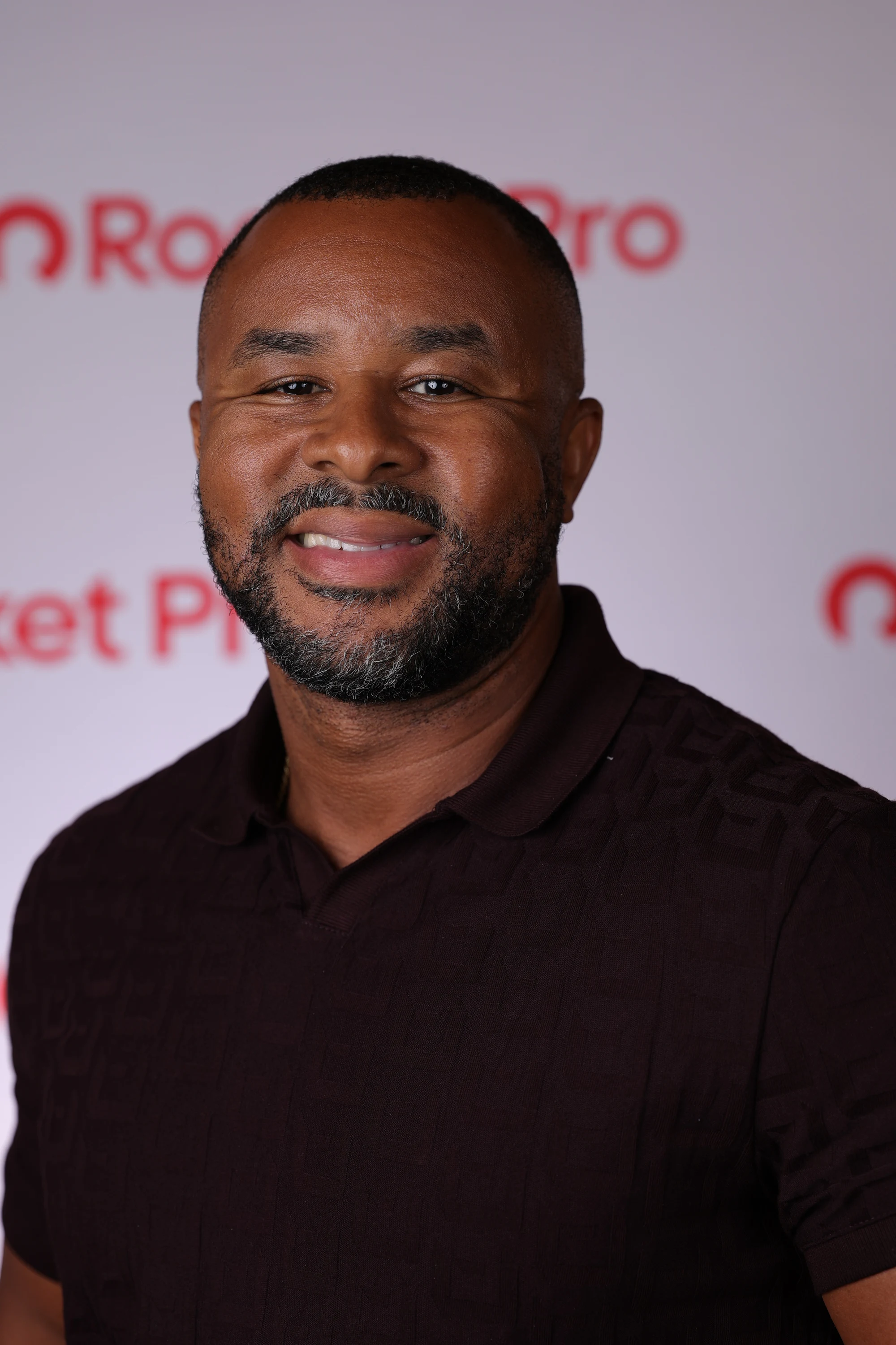 Headshot off the white backdrop, relaxed expression at Rocket Pro Experience 2026