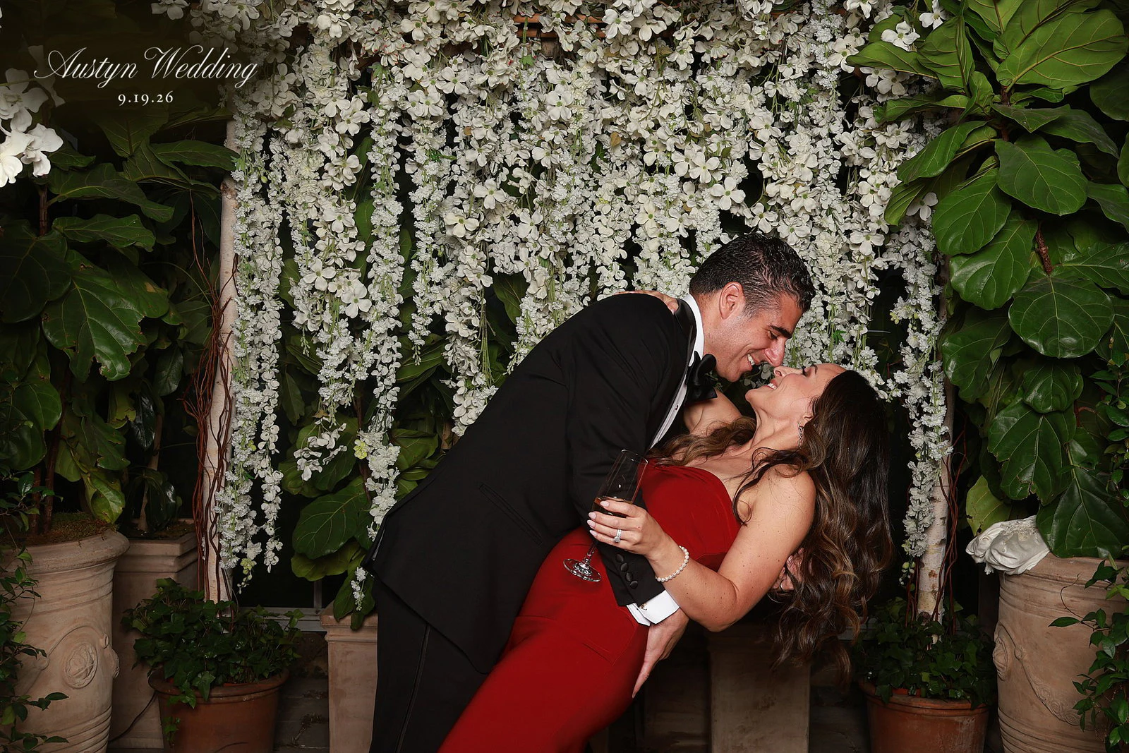 A couple kissing in a dip at Ryley + Lauren at Planterra Conservatory