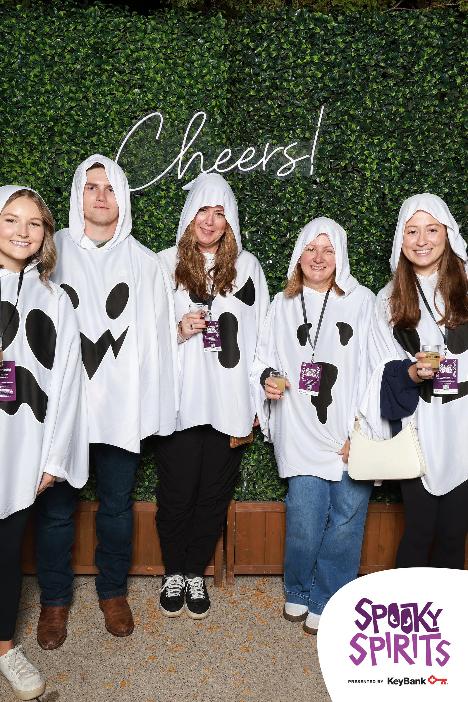 The seven ghosts in a row, drinks in hand at Spooky Spirits at the Detroit Zoo 2026