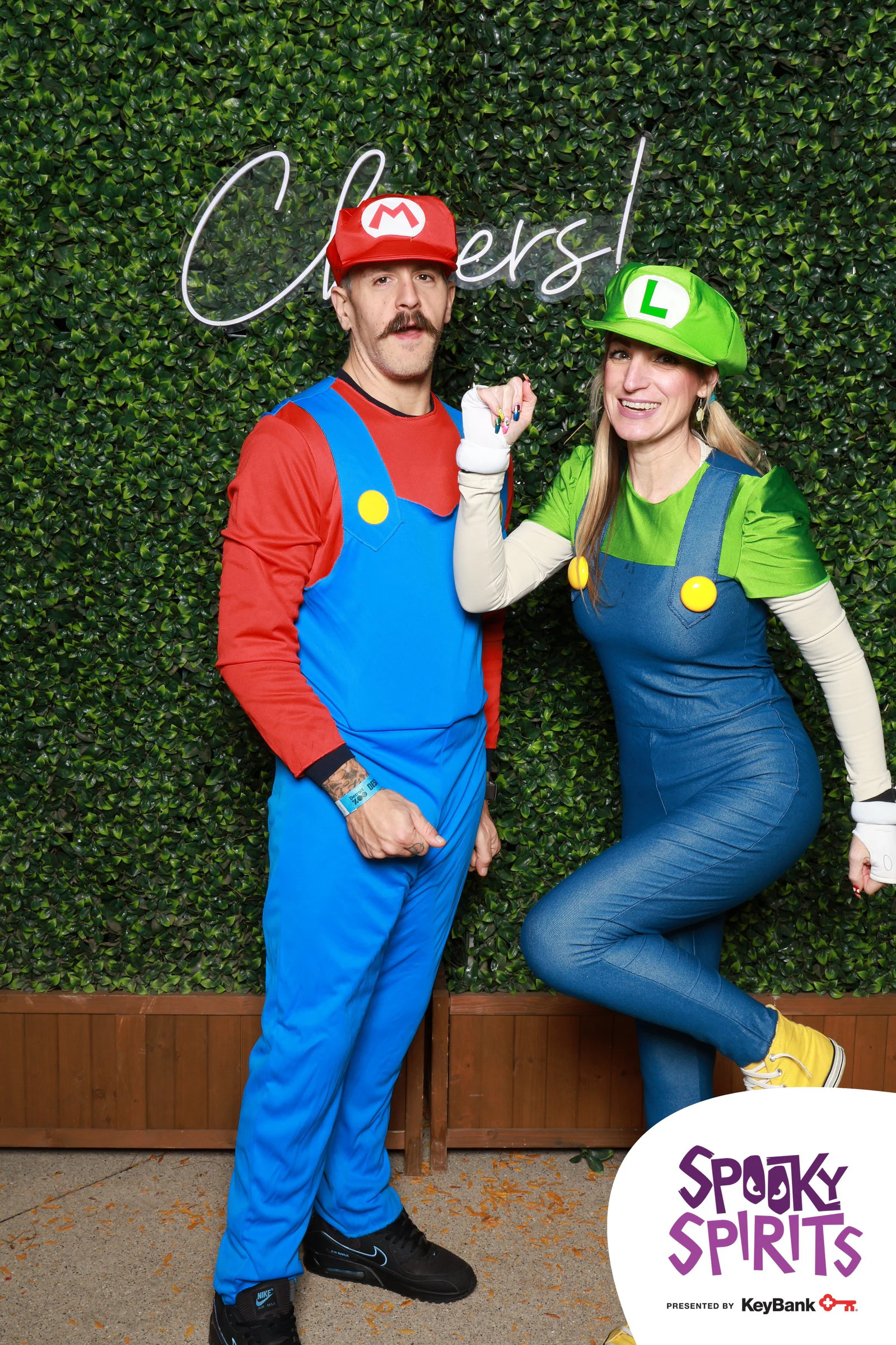 Luigi leaning back with a kick while Mario stands tall at Spooky Spirits at the Detroit Zoo 2026