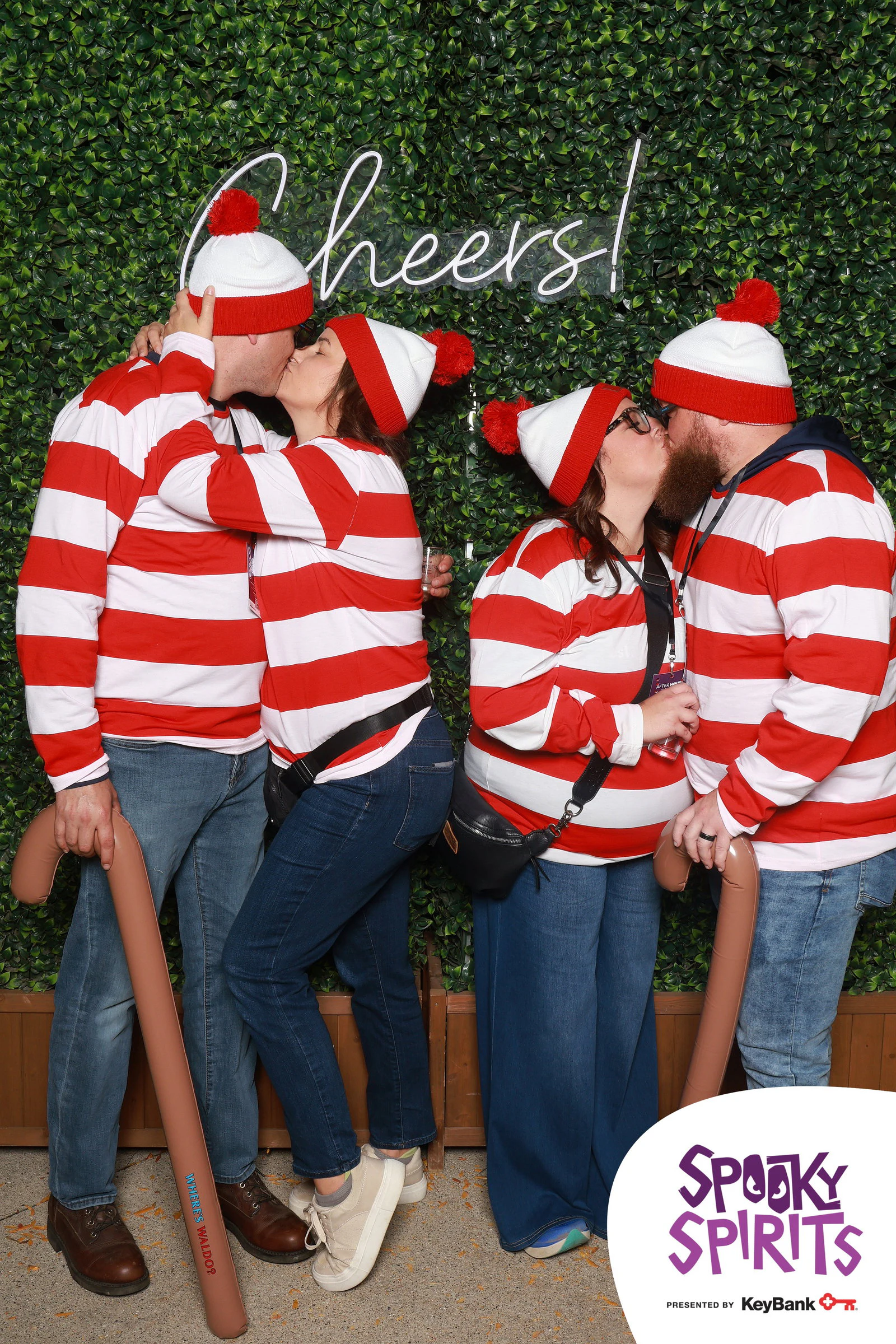 Four friends dressed as Waldo in red and white stripes, holding walking canes at Spooky Spirits at the Detroit Zoo 2026