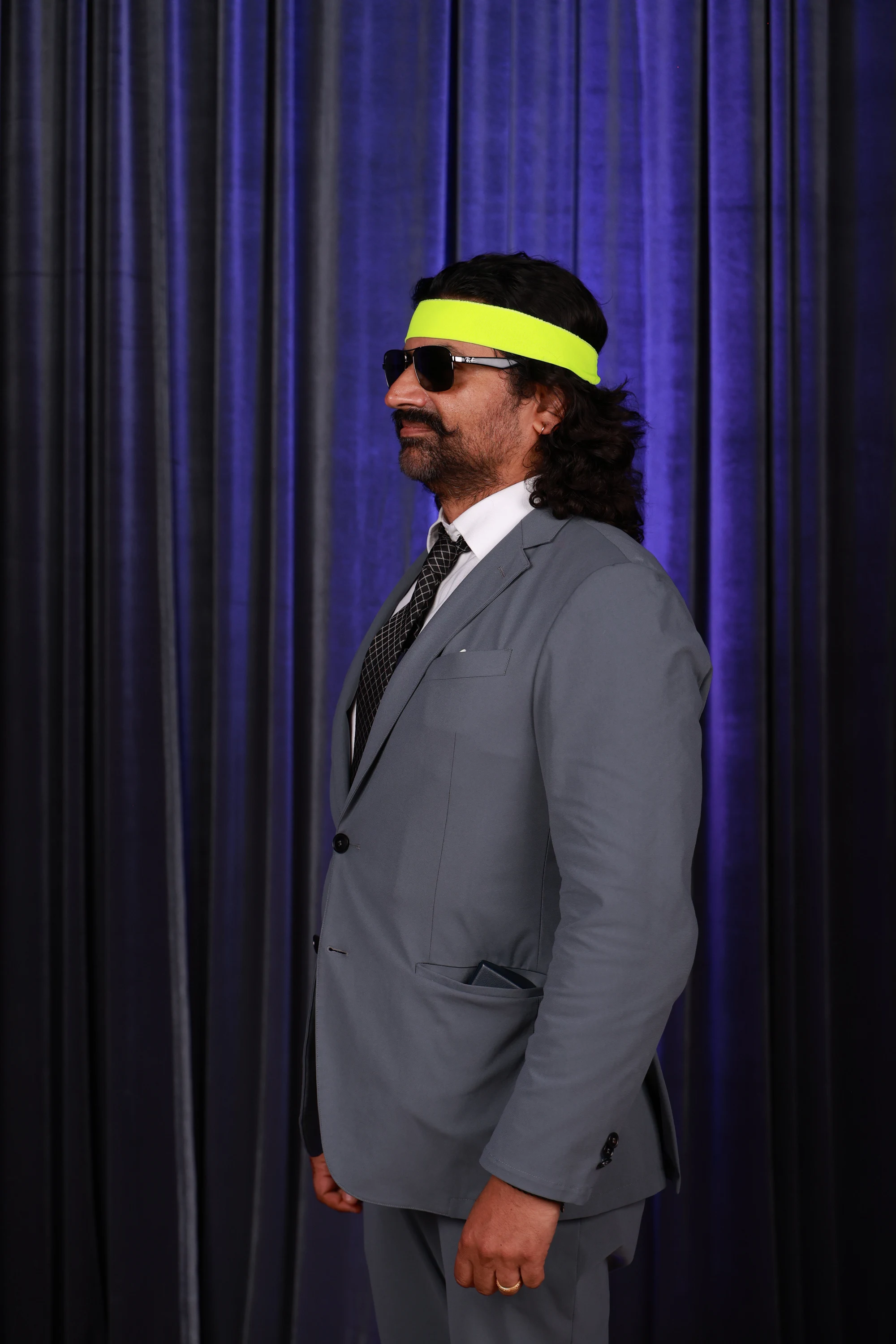 Guest hamming it up in neon shades and a headband at Puja + Curtis at State Savings Bank