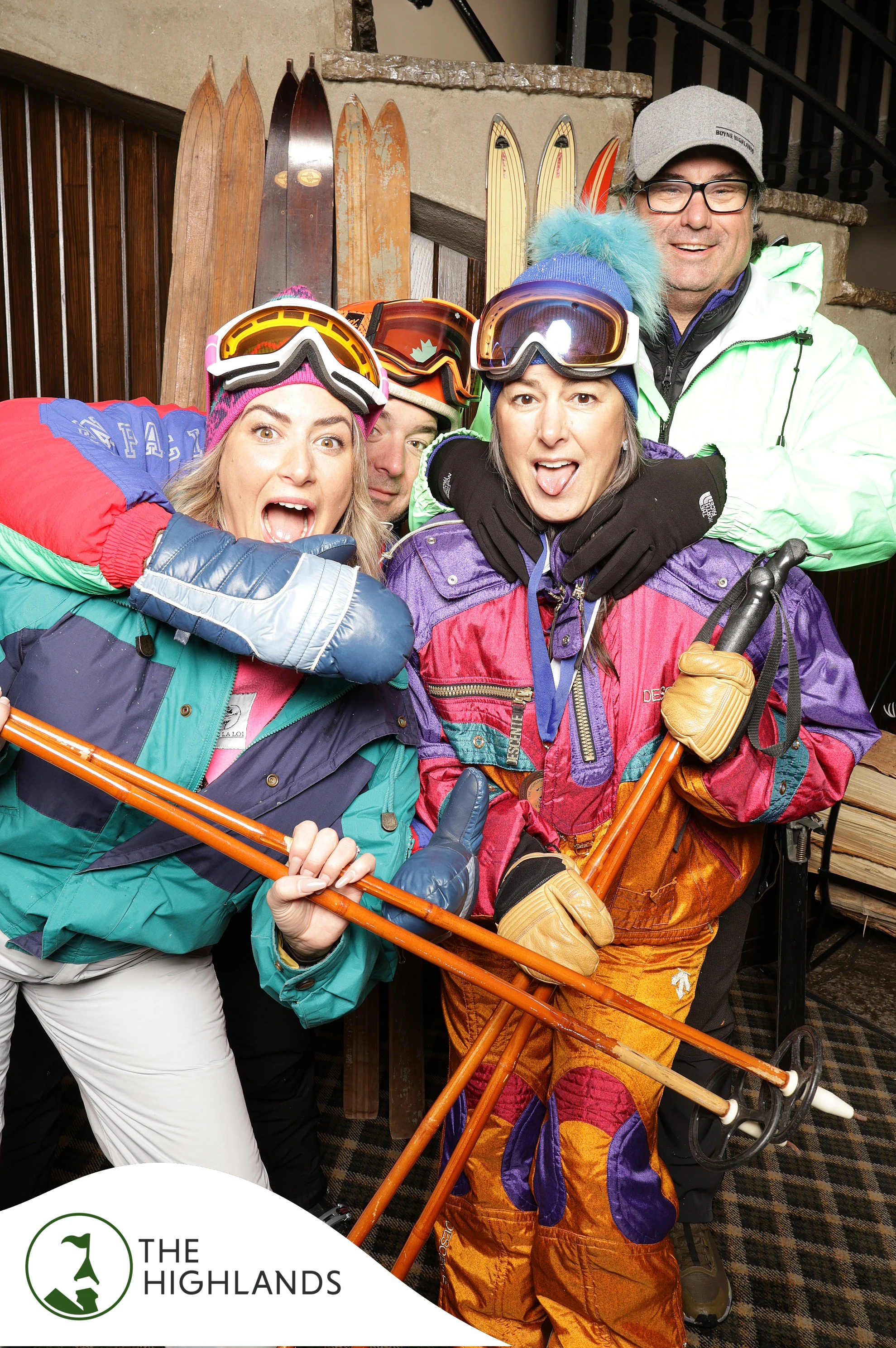 The four friends in neon ski suits pulling faces at The Highlands 61st Anniversary