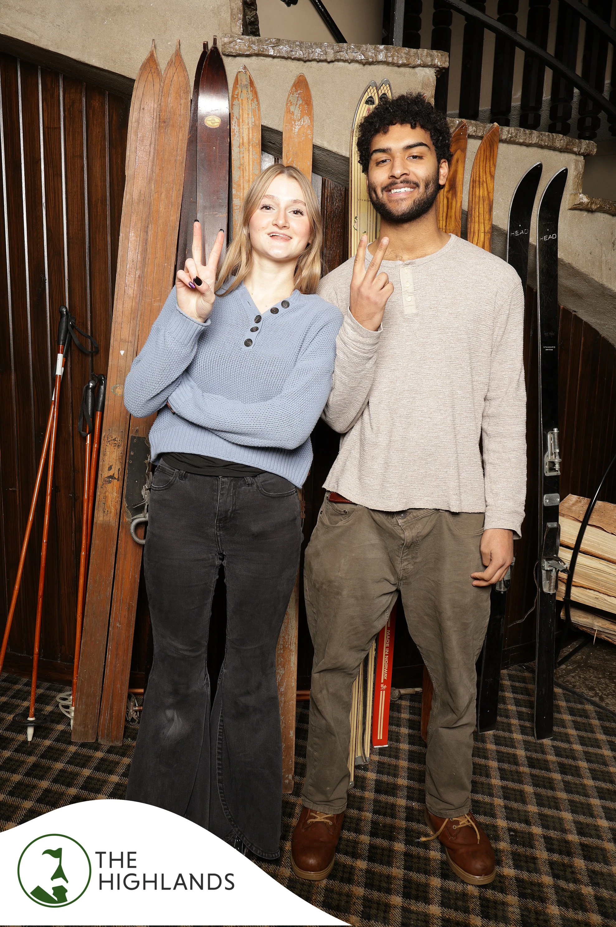 The couple both throwing peace signs at The Highlands 61st Anniversary