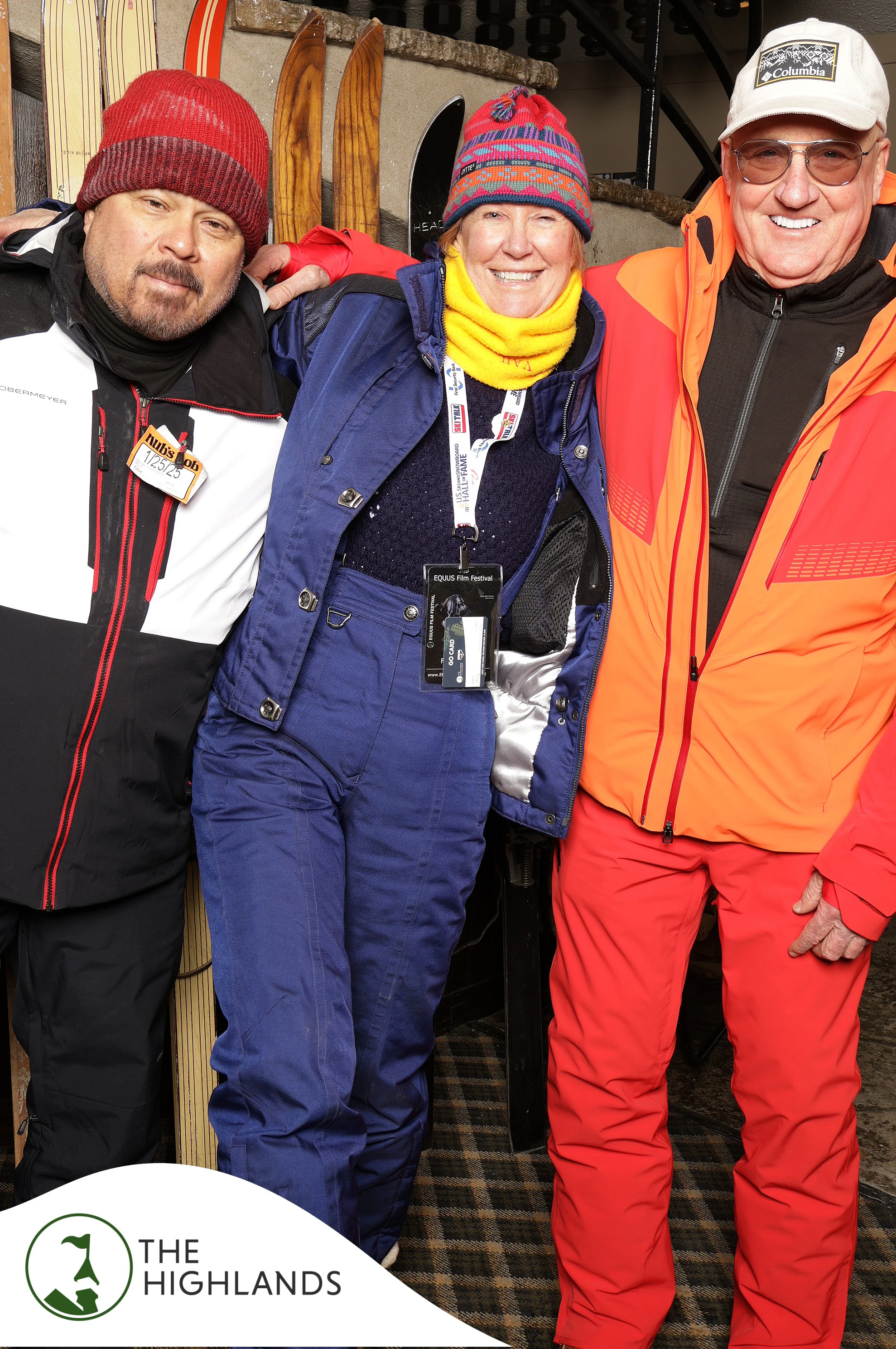 The three friends in ski gear laughing together at The Highlands 61st Anniversary