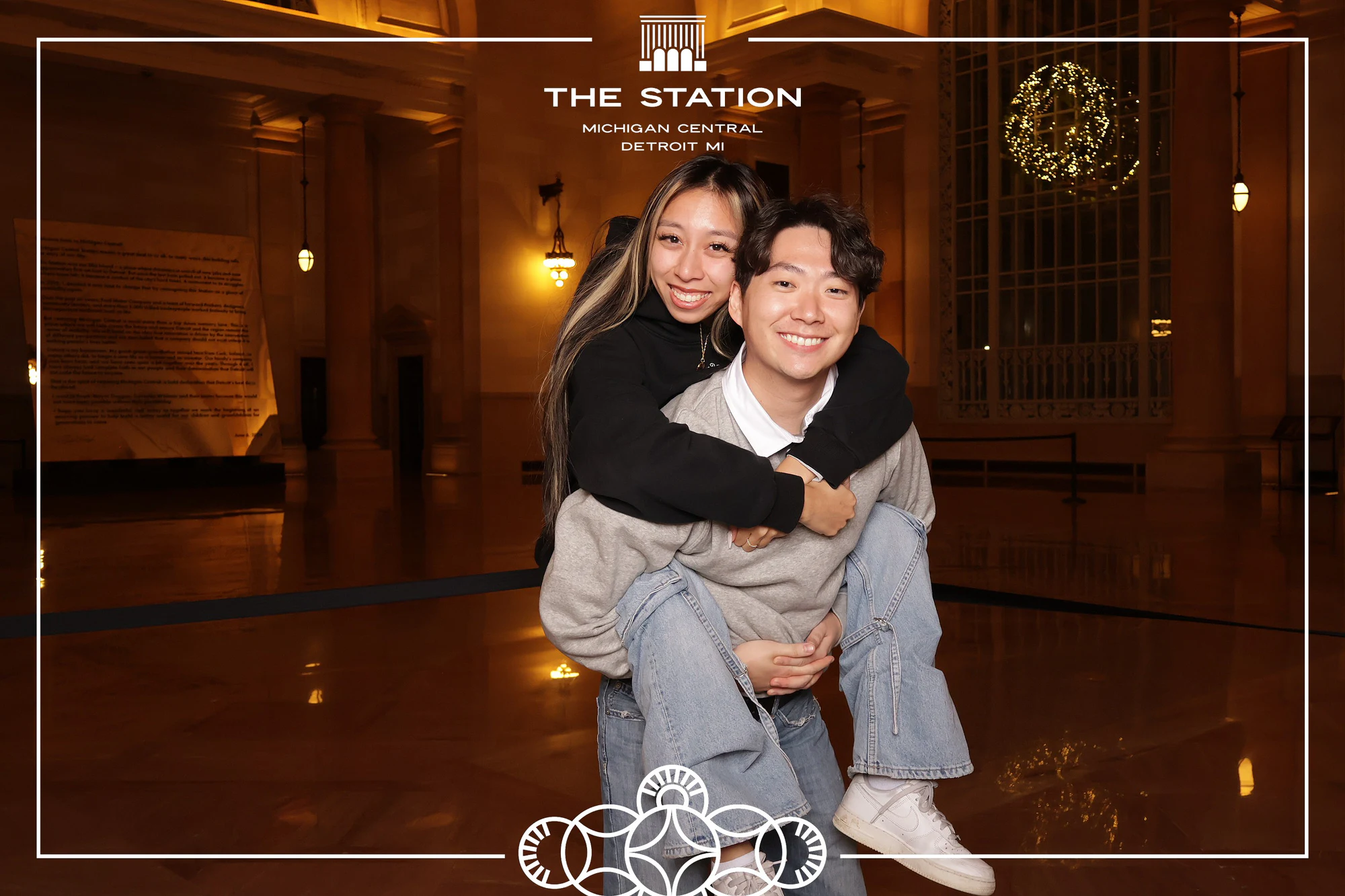 Mom and son piggyback at Winter at the Station, Michigan Central