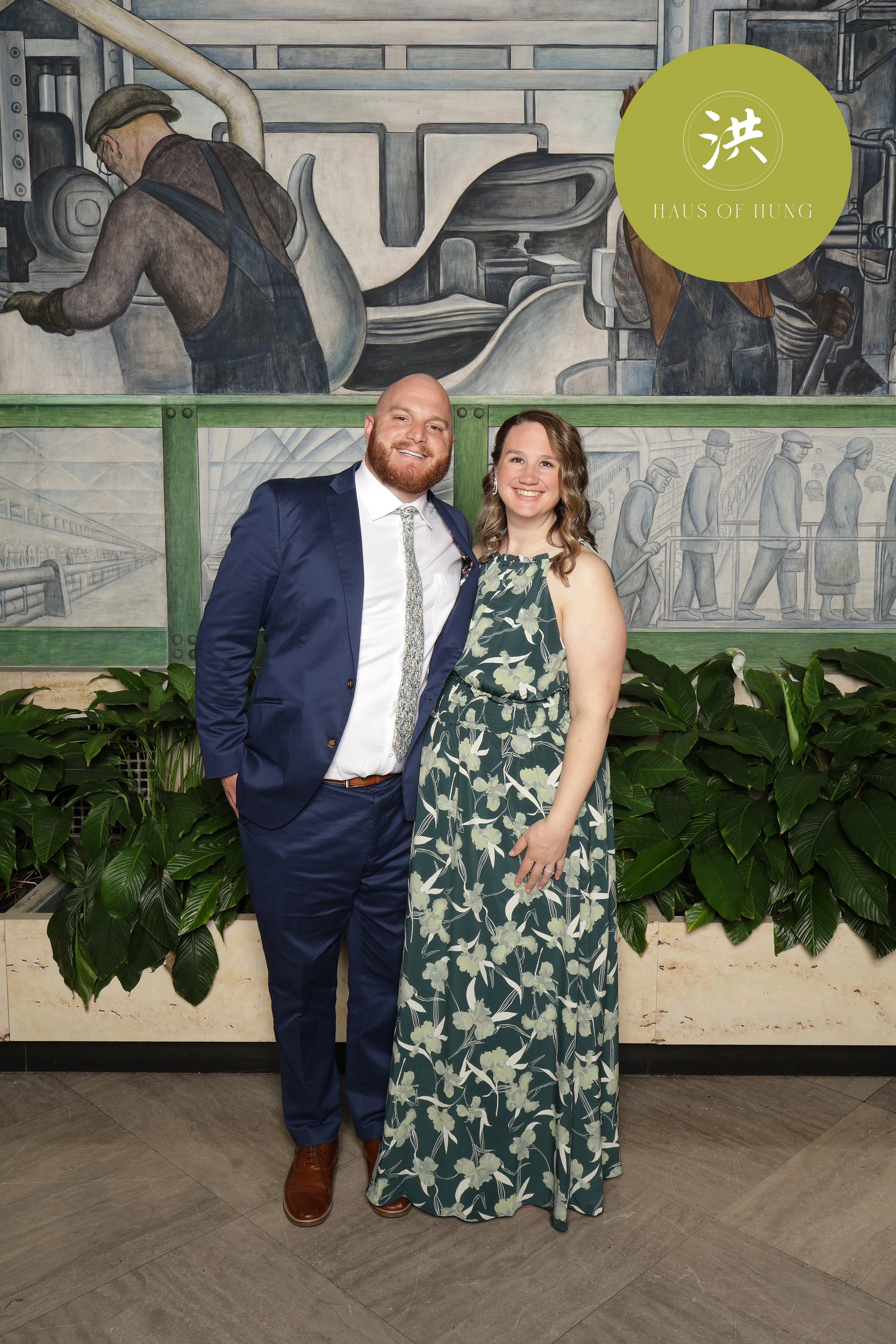 Couple, navy suit and green gown, relaxed at Lesley + Kevin at the Detroit Institute of Arts