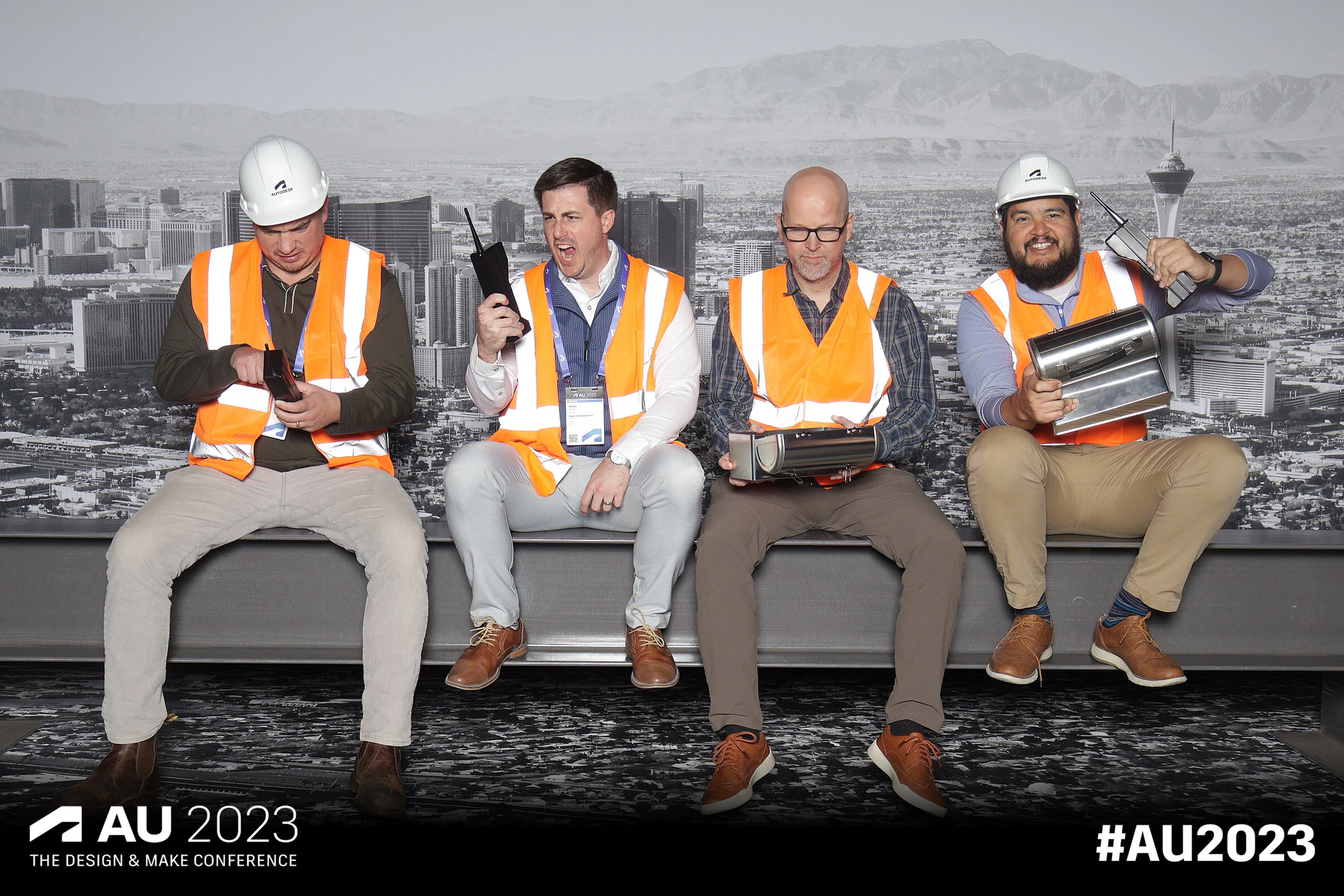Four seated with laptops and props at Autodesk University 2023