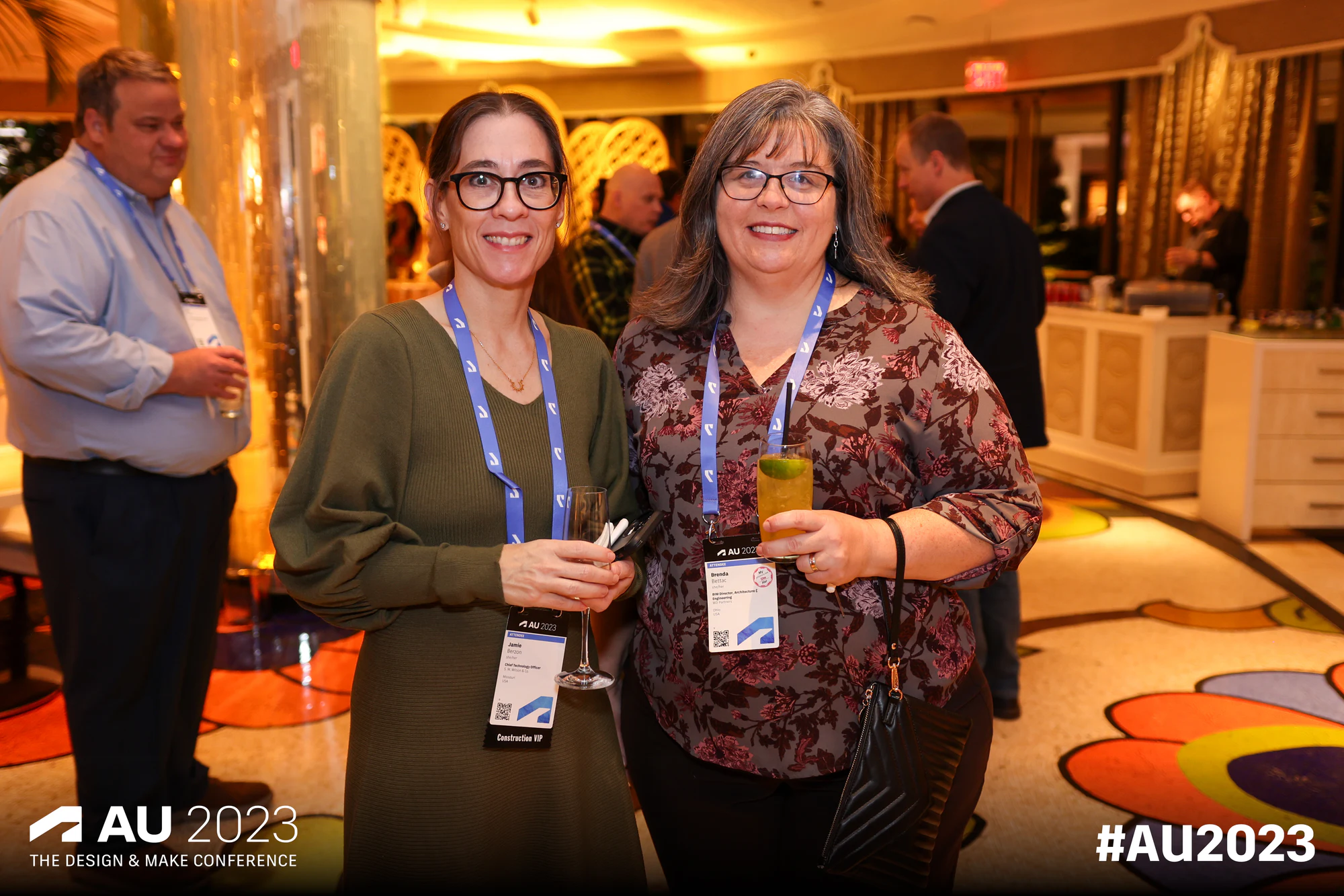 Two women with conference badges at Autodesk University 2023